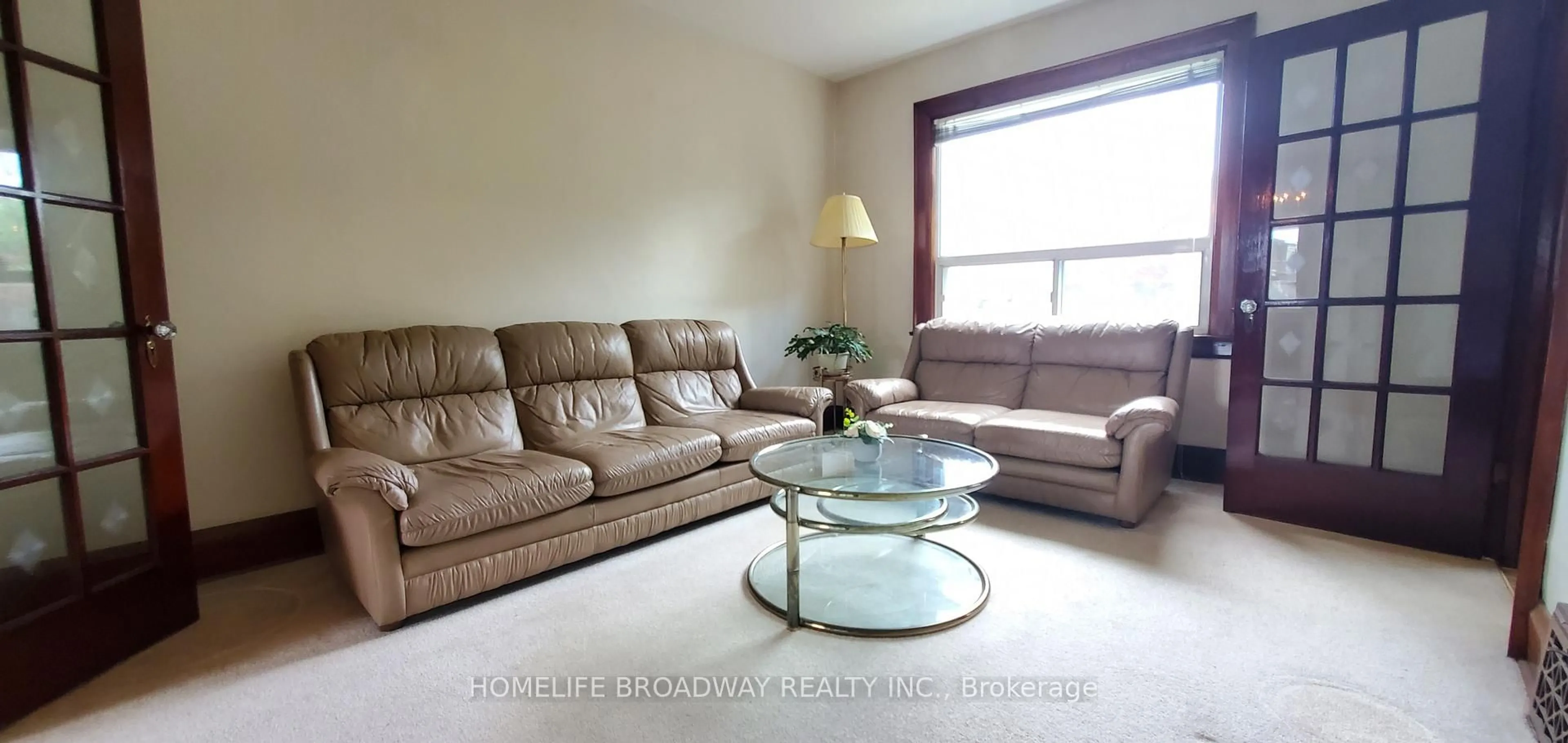 Living room with furniture, wood/laminate floor for 223 Westwood Ave, Toronto Ontario M4J 2H3