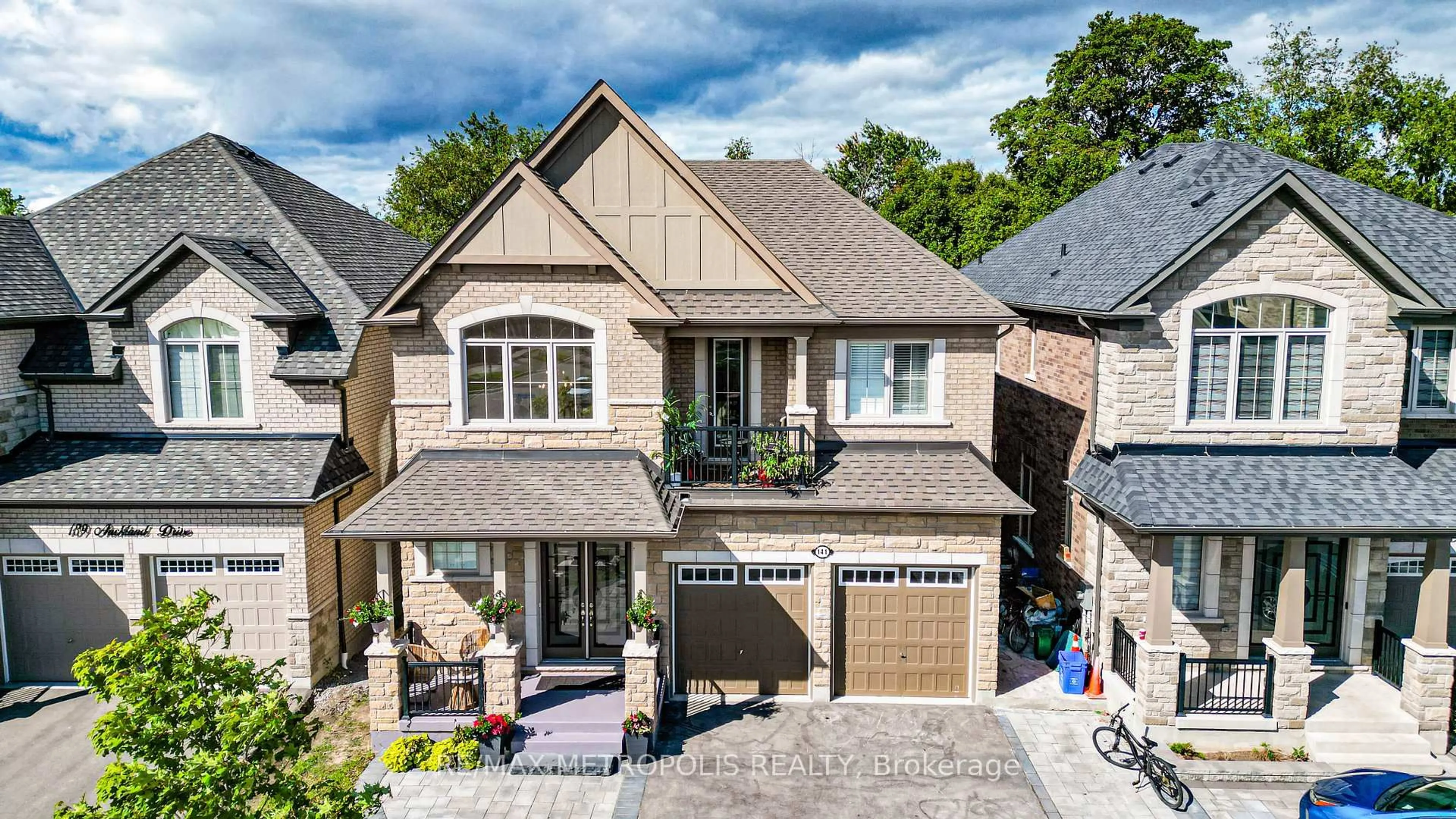 Home with brick exterior material, street for 141 AUCKLAND Dr, Whitby Ontario L1P 0J2