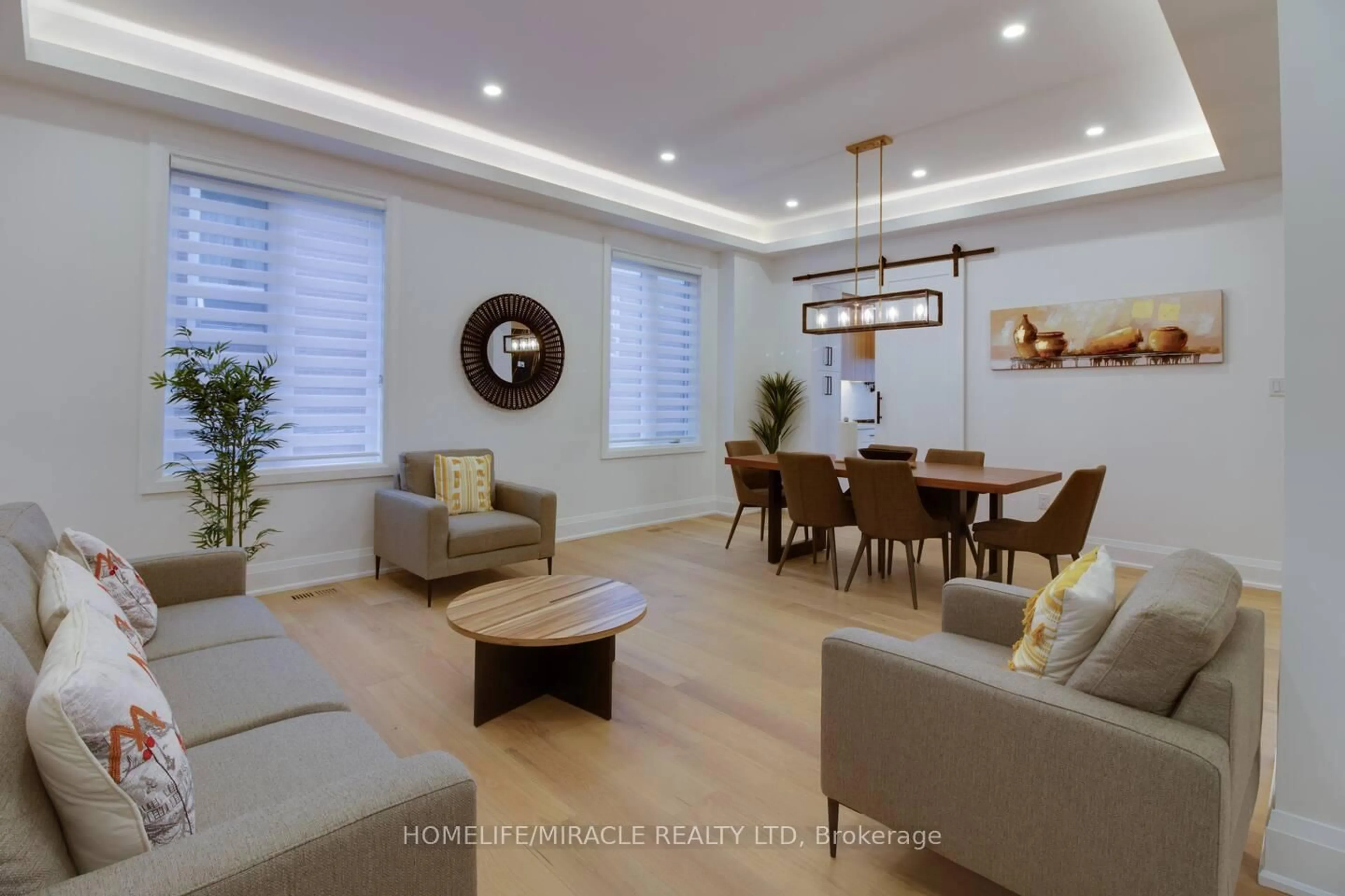 Living room with furniture, wood/laminate floor for 10 Stamford Sq, Toronto Ontario M1L 1X3