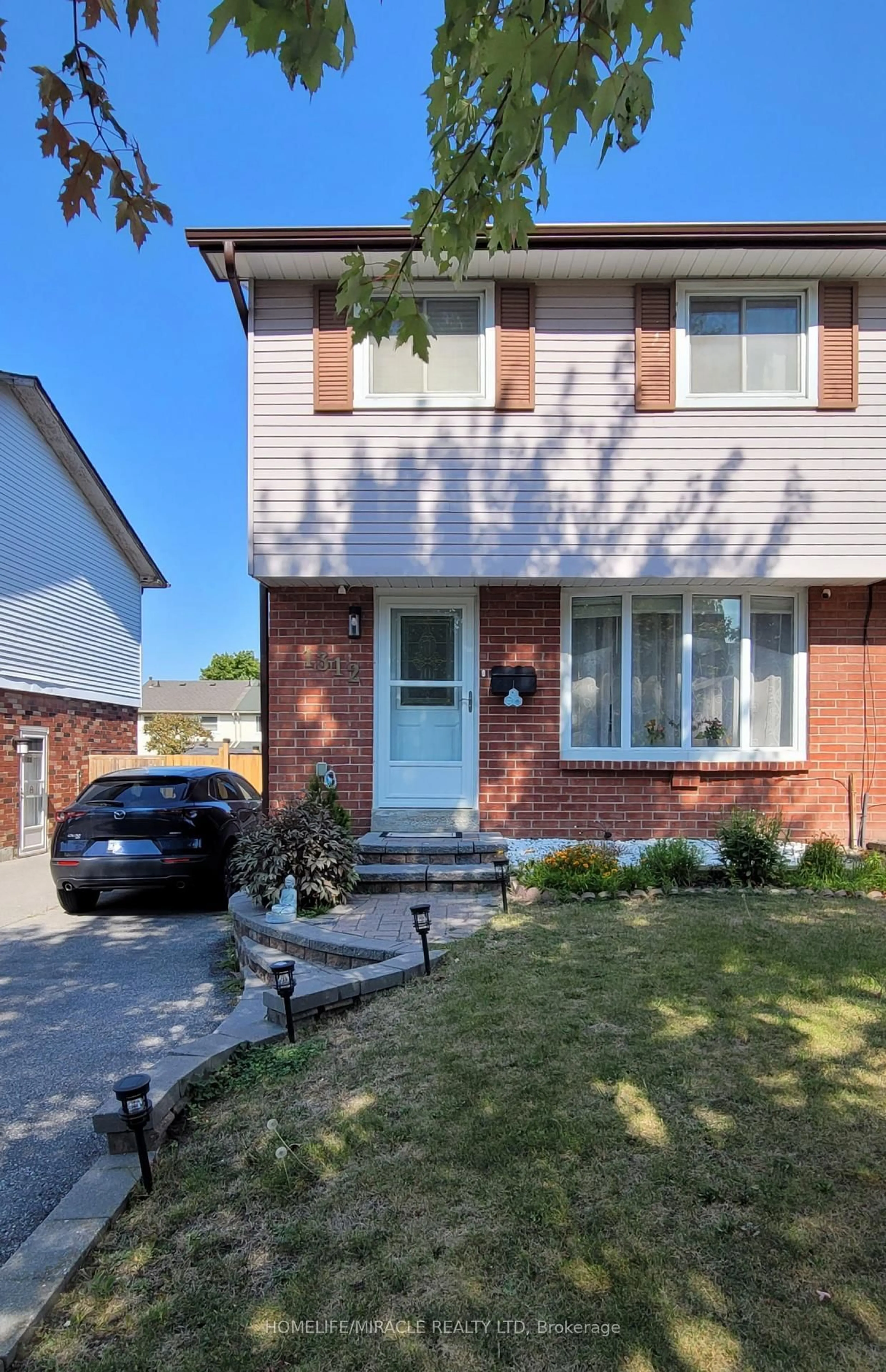 Home with brick exterior material, street for 1312 Cherrydown Dr, Oshawa Ontario L1H 8C9
