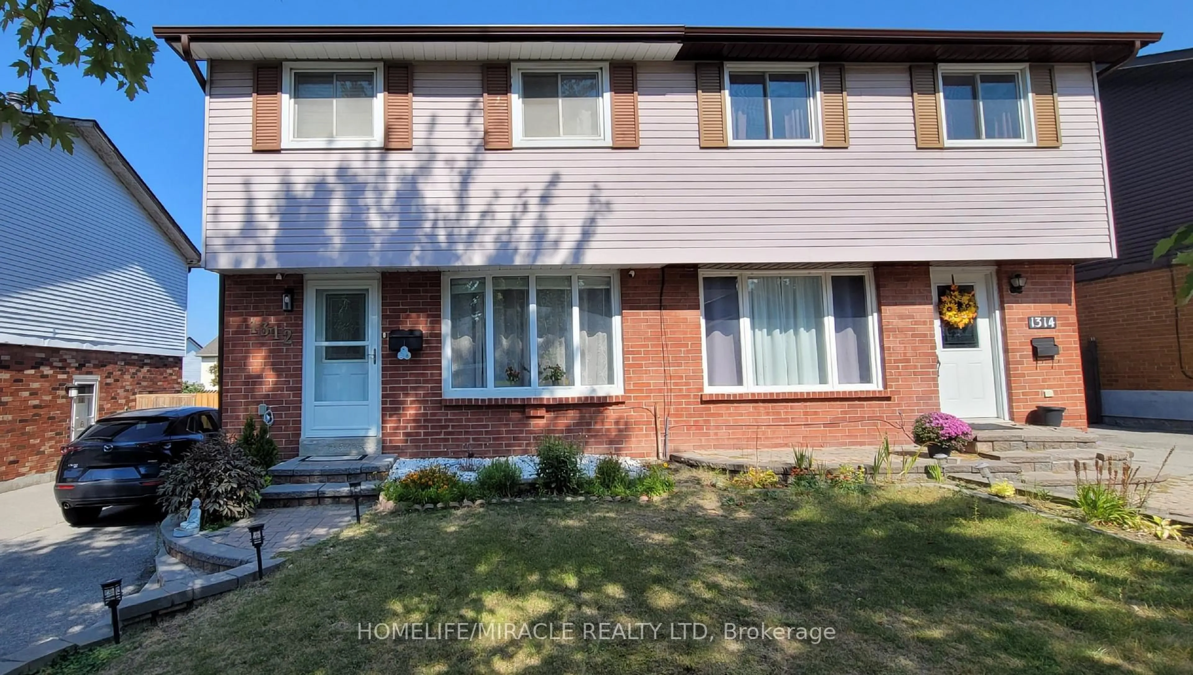 Home with brick exterior material, street for 1312 Cherrydown Dr, Oshawa Ontario L1H 8C9