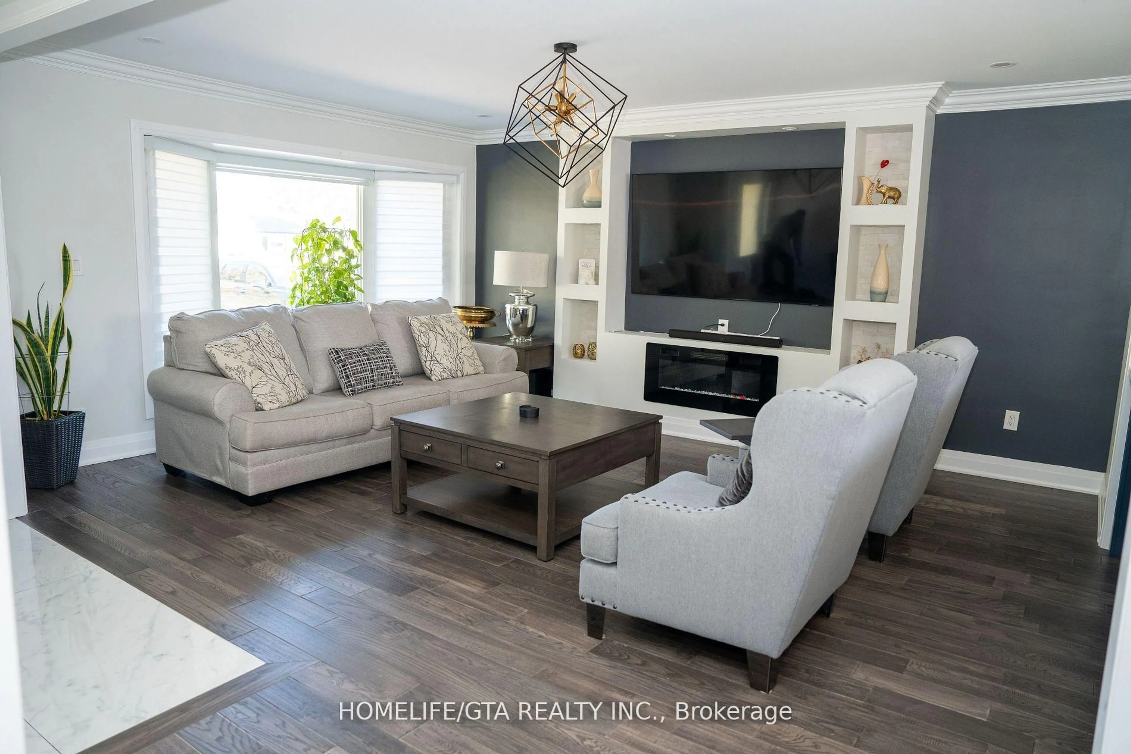 Living room with furniture, wood/laminate floor for 439 Rossland Rd, Oshawa Ontario L1J 3G9