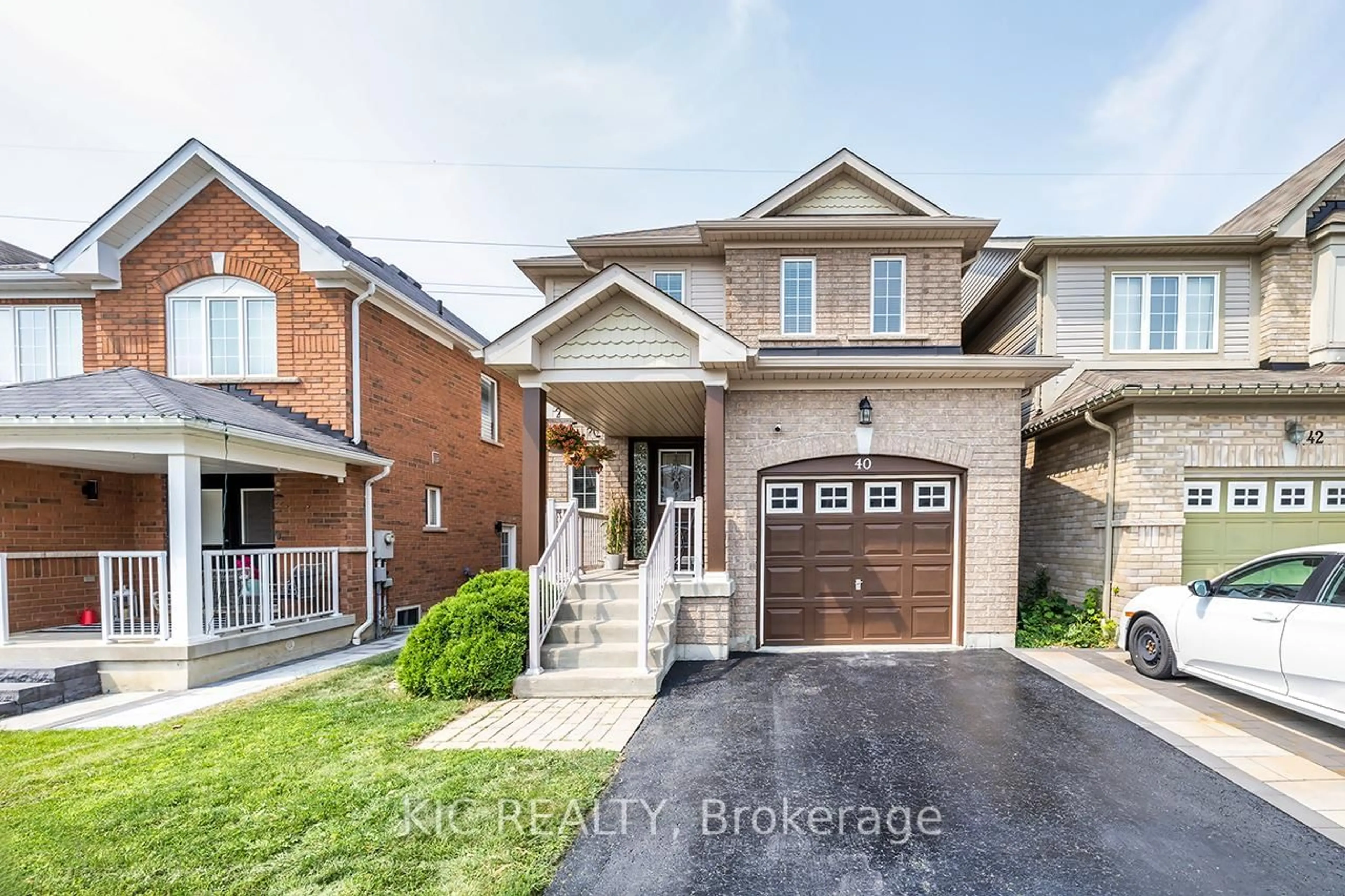 Home with brick exterior material, street for 40 Puttingedge Dr, Whitby Ontario L1R 0H7