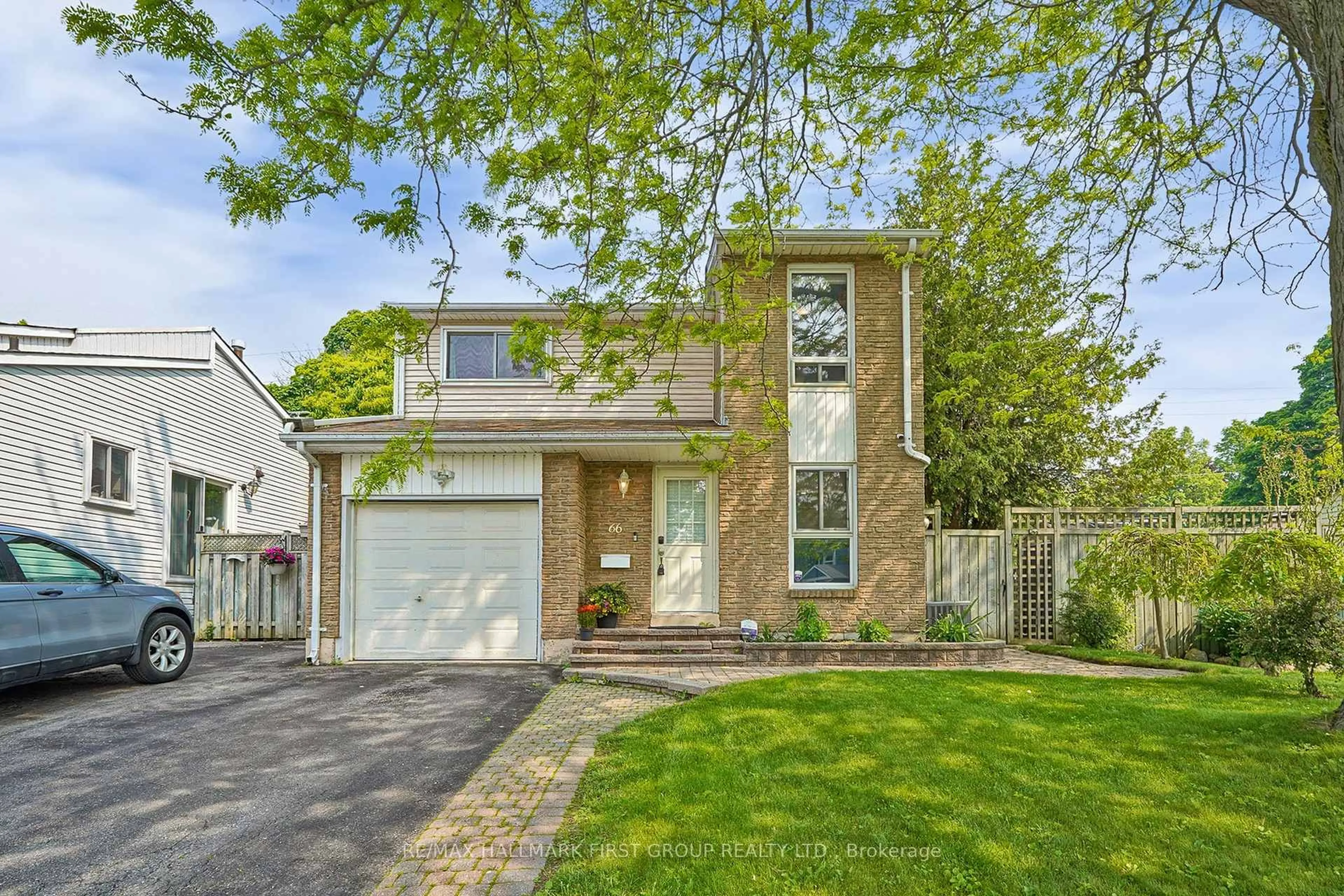 Home with brick exterior material, street for 66 Medley Lane, Ajax Ontario L1S 3P6