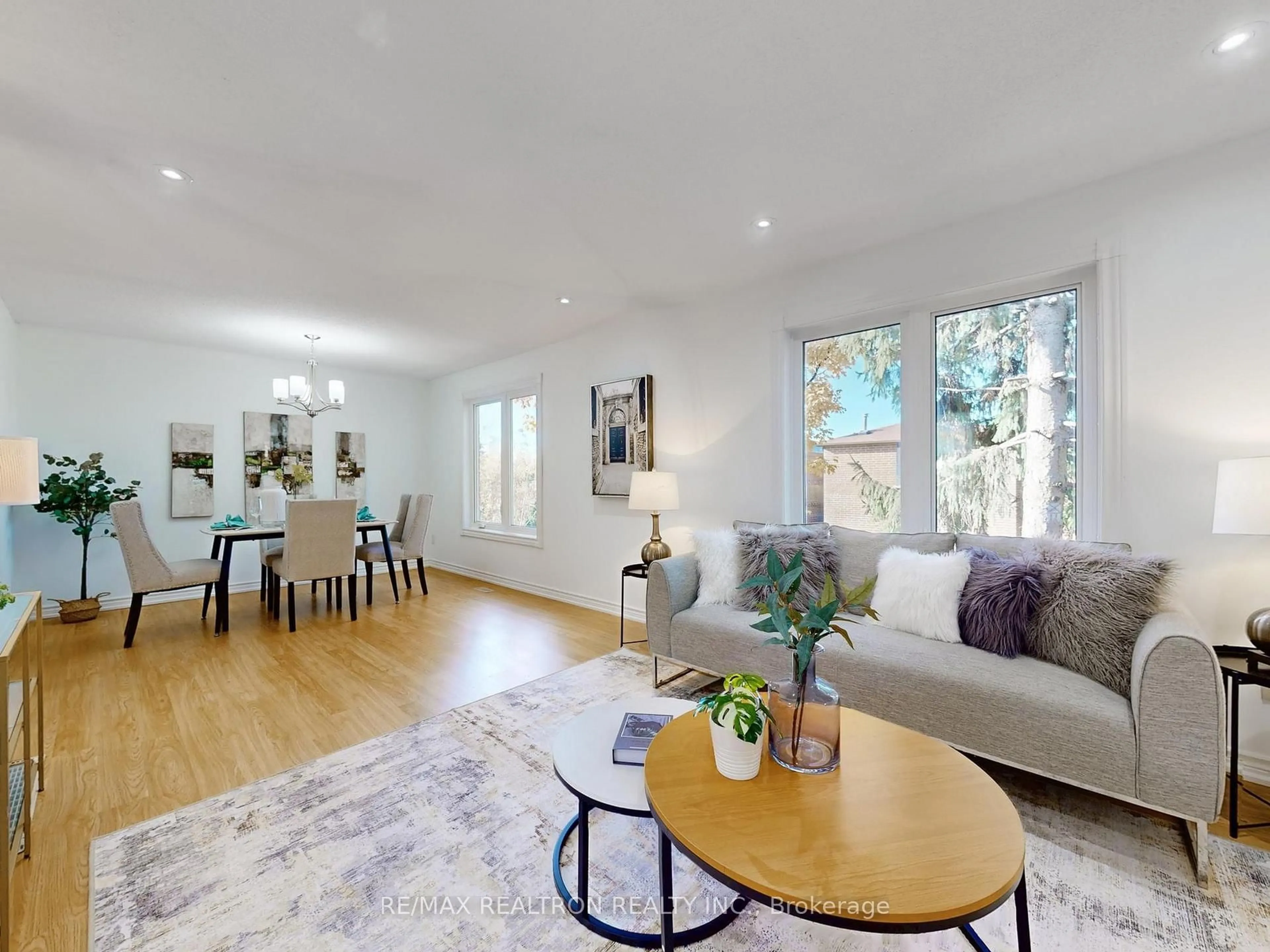 Living room with furniture, wood/laminate floor for 5021 Sheppard Ave #9, Toronto Ontario M1S 4R6