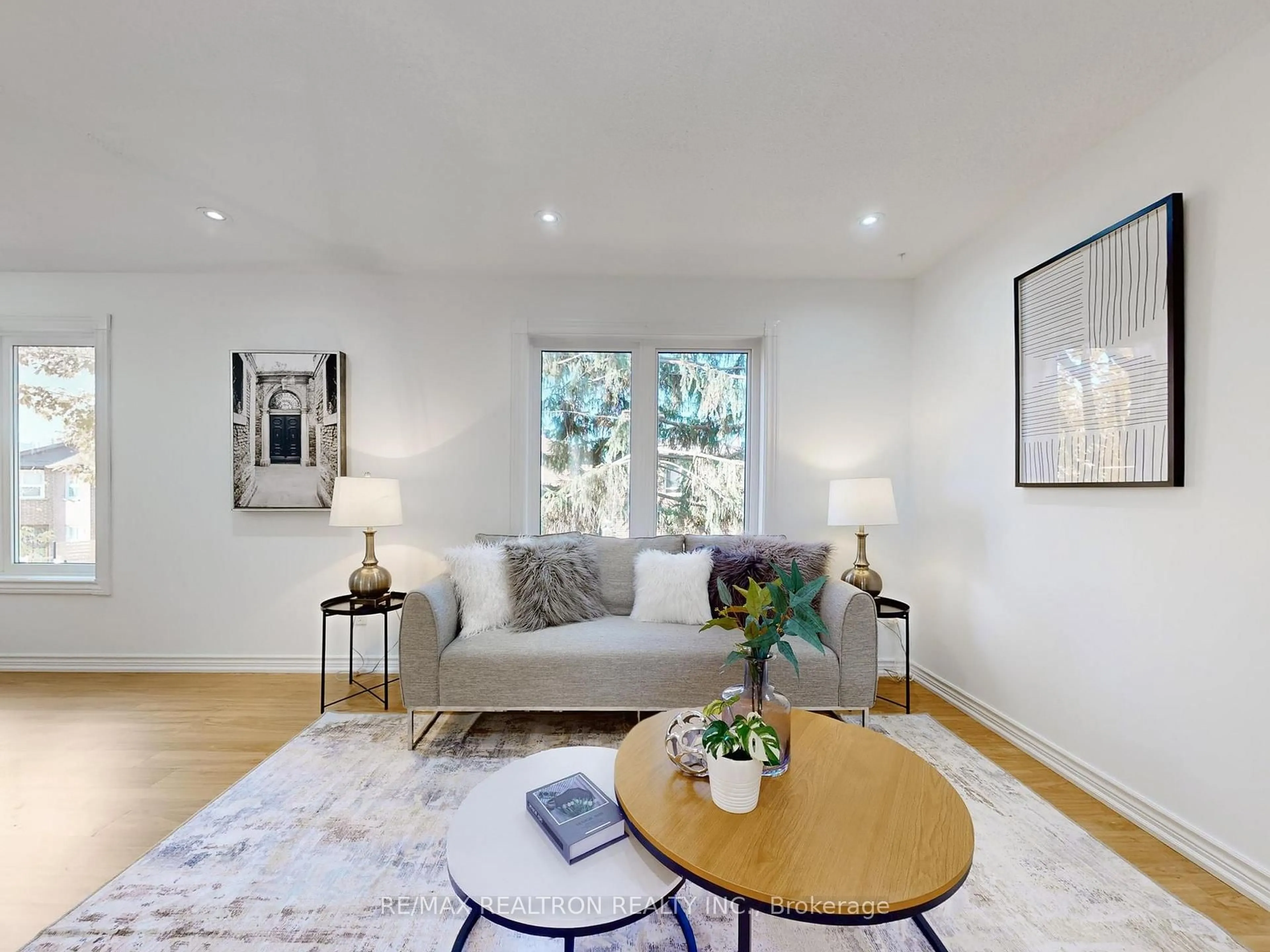 Living room with furniture, wood/laminate floor for 5021 Sheppard Ave #9, Toronto Ontario M1S 4R6