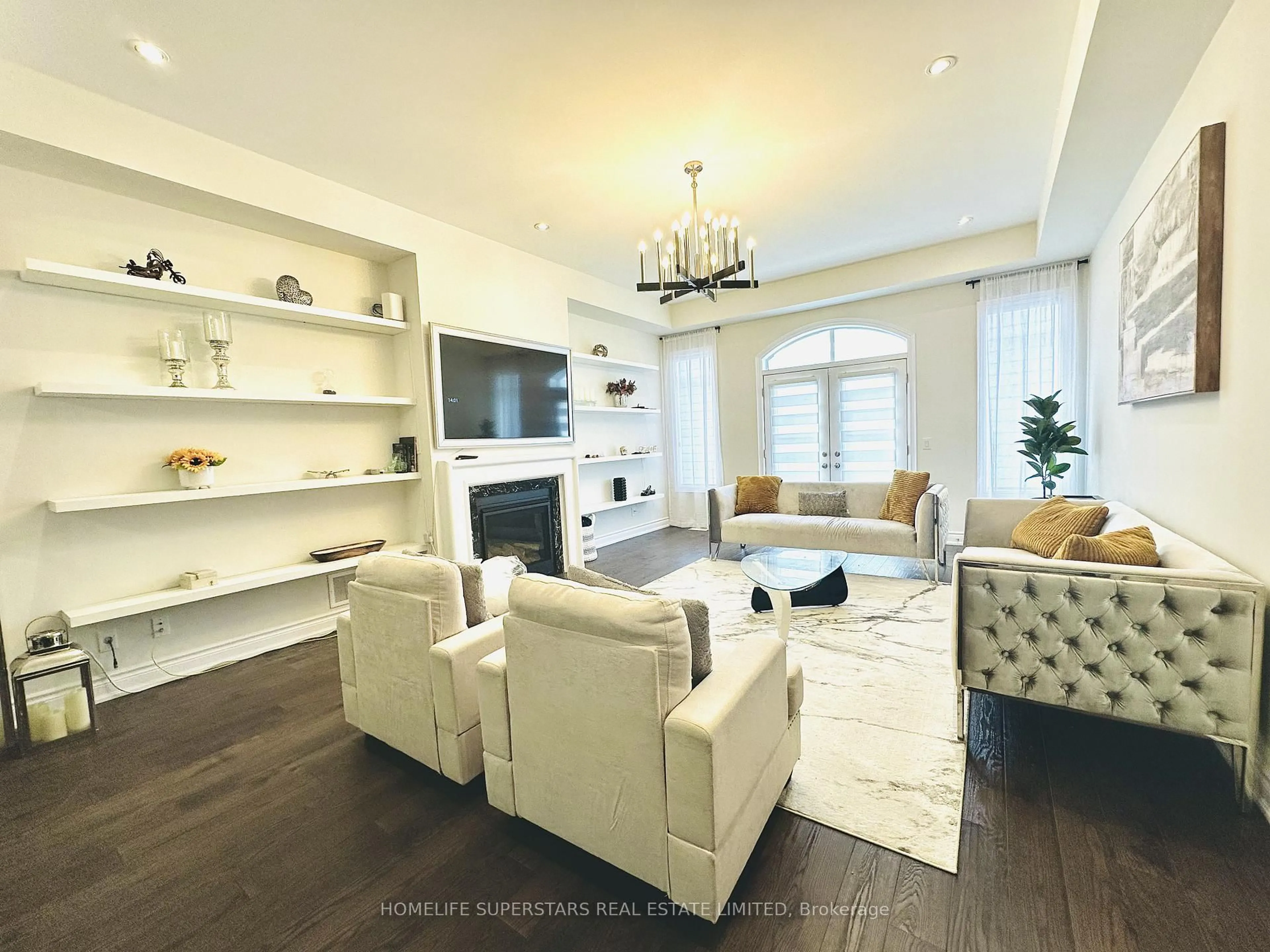 Living room with furniture, wood/laminate floor for 55 Christine Elliott Ave, Whitby Ontario L1P 0C8