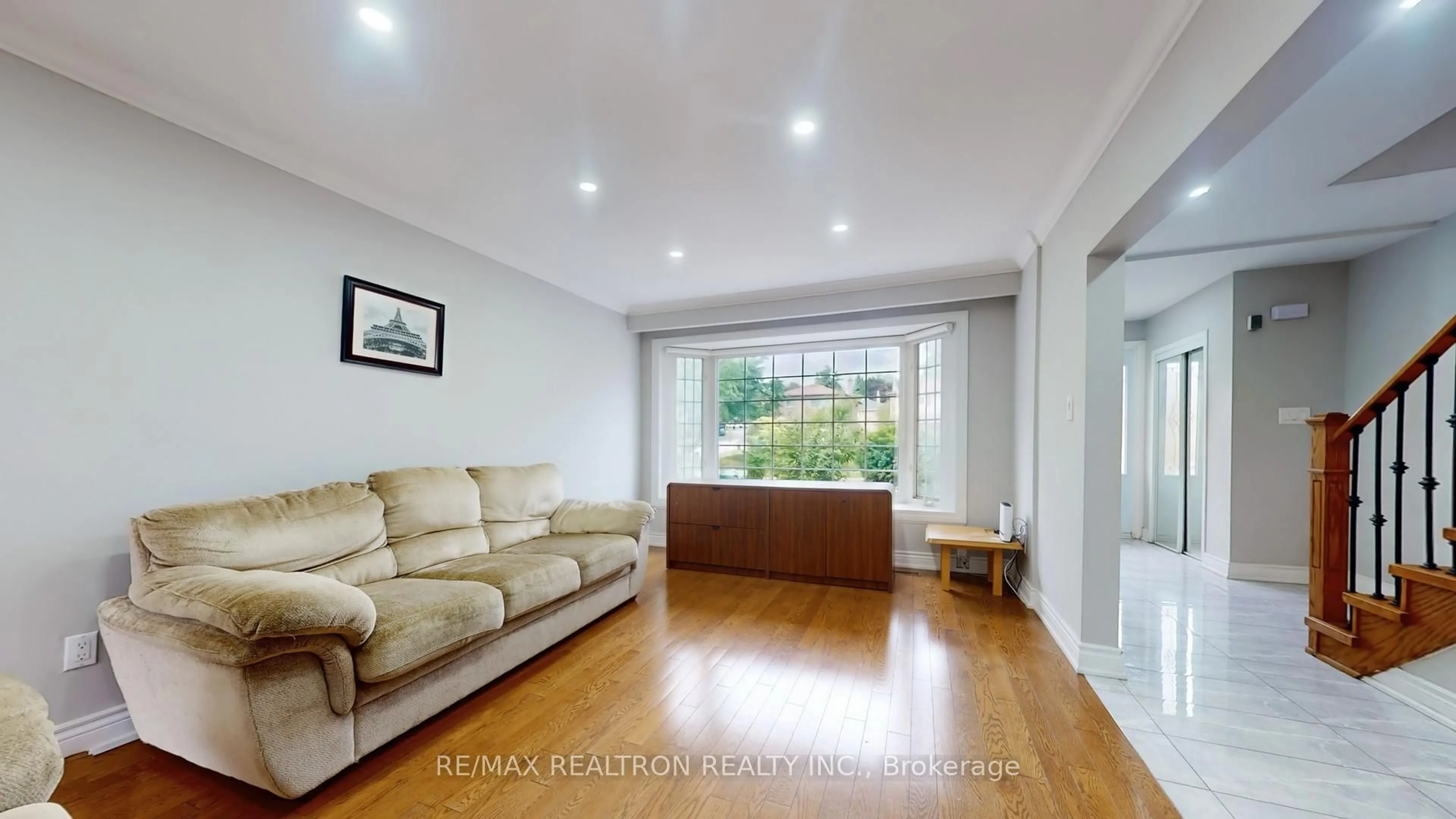 Living room with furniture, wood/laminate floor for 154 Merkley Sq, Toronto Ontario M1G 2Y8