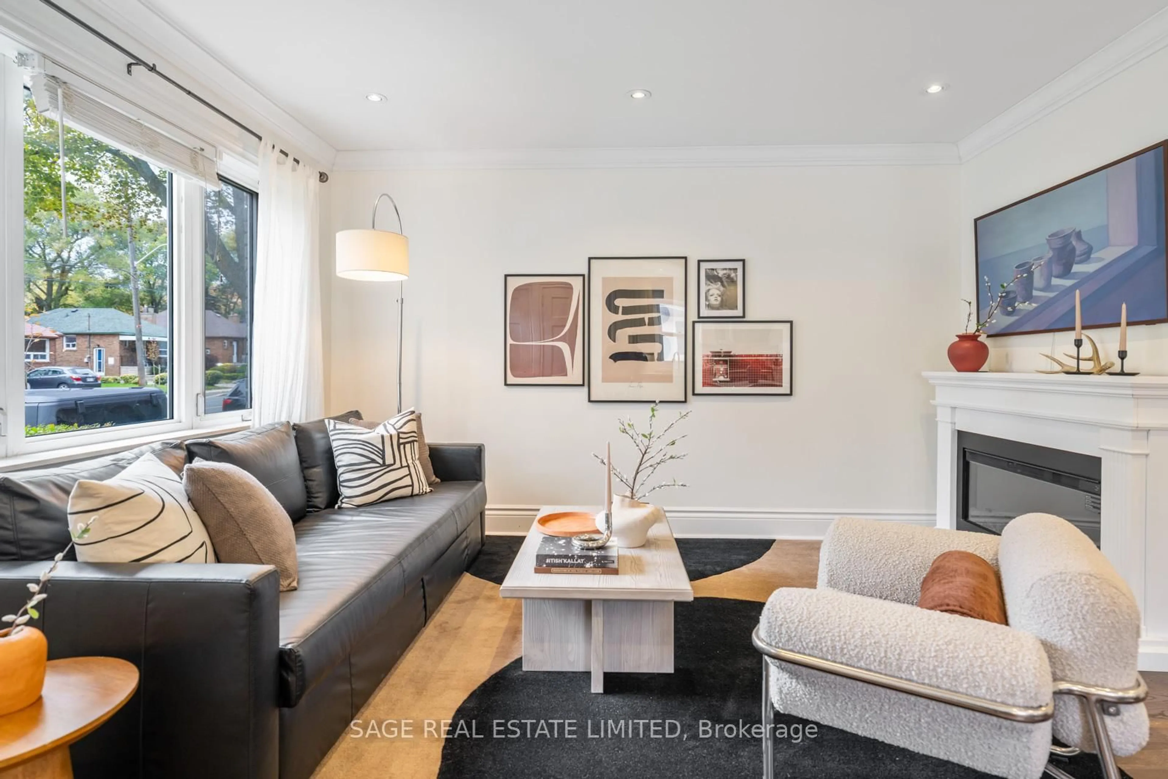 Living room with furniture, wood/laminate floor for 307 Warden Ave, Toronto Ontario M1N 3A3