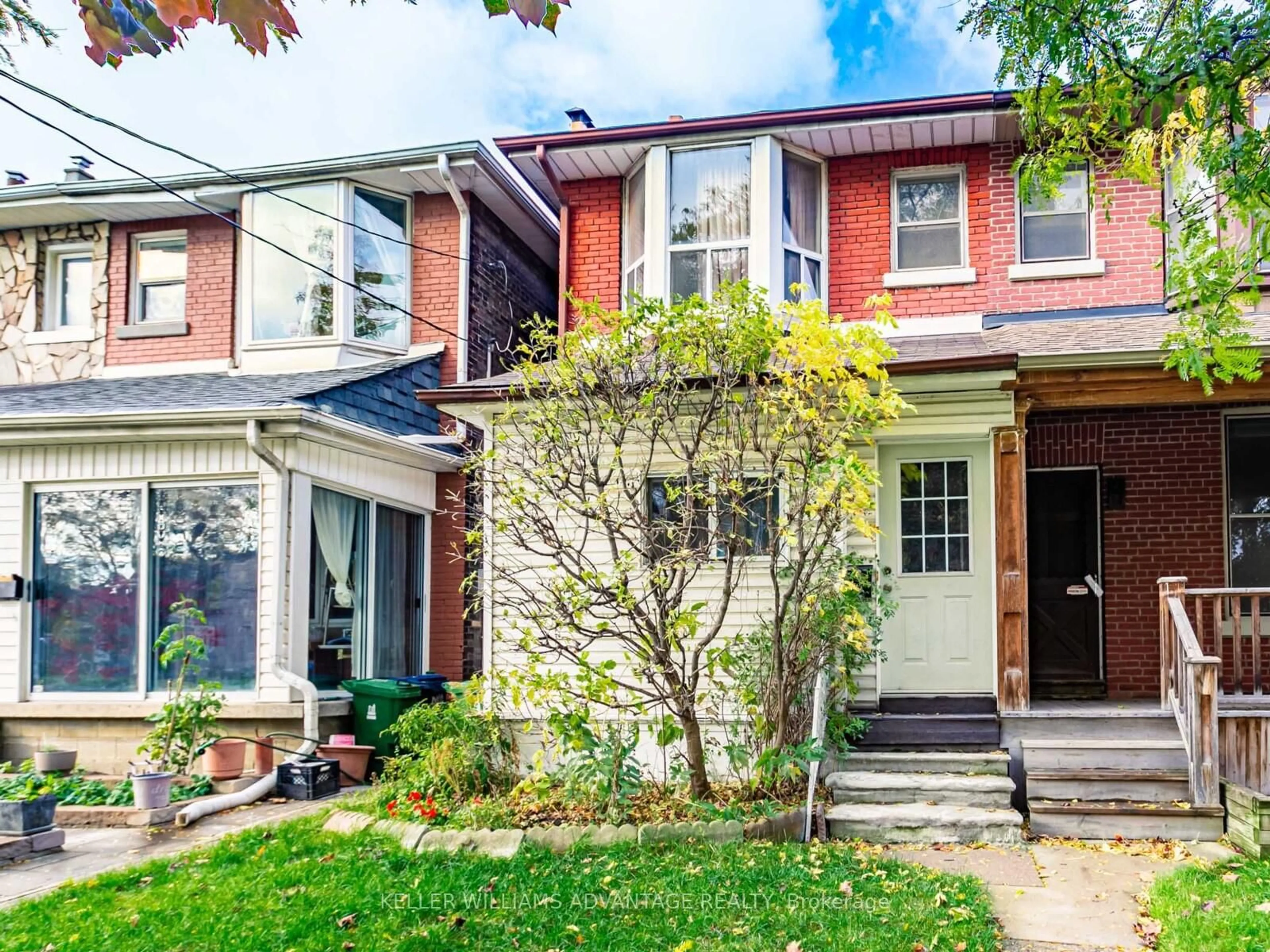 Home with brick exterior material, street for 1042 Dundas St, Toronto Ontario M4M 1R8