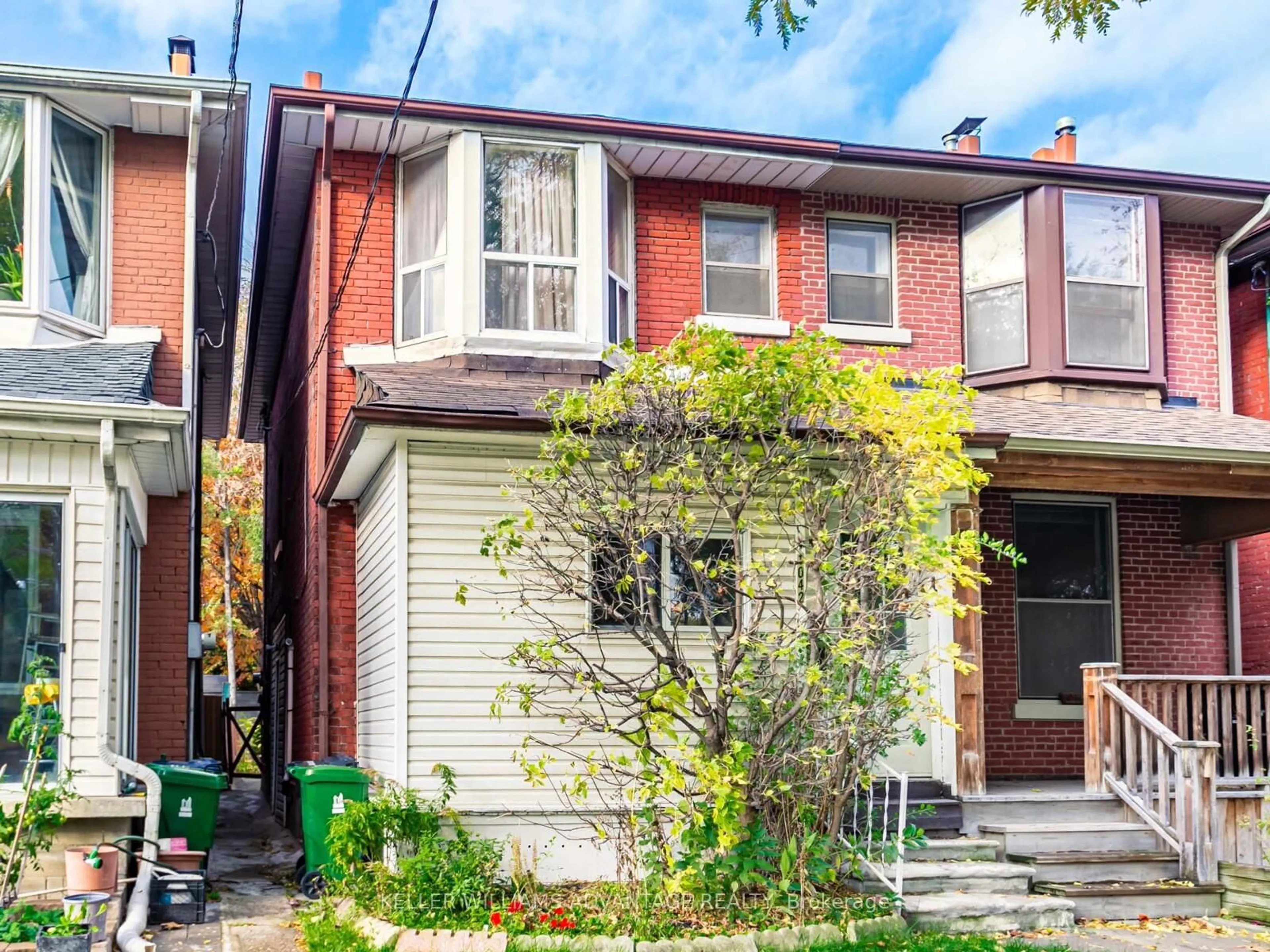 Home with brick exterior material, street for 1042 Dundas St, Toronto Ontario M4M 1R8