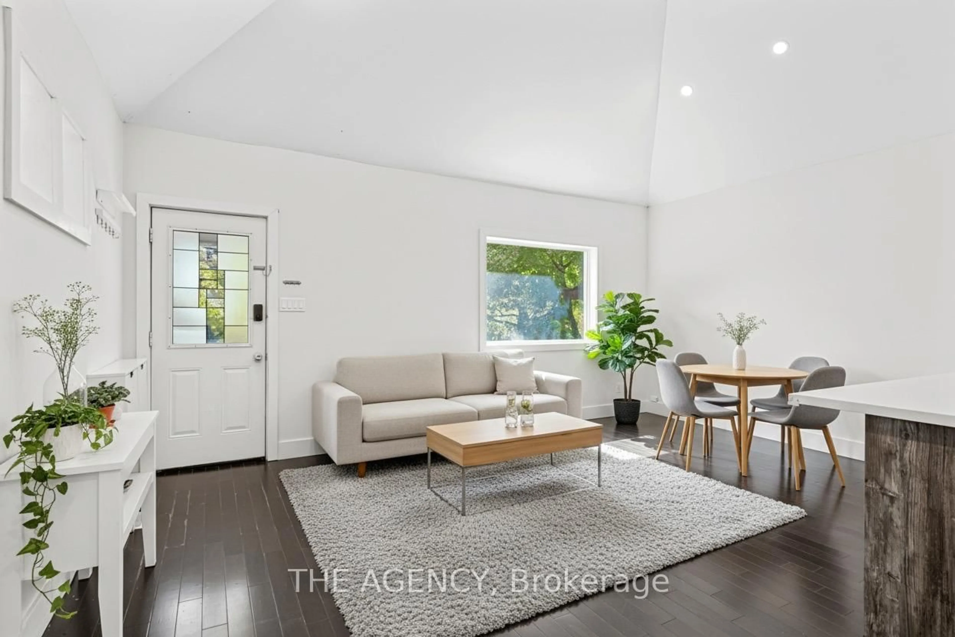 Living room with furniture, wood/laminate floor for 26 Gatwick Ave, Toronto Ontario M4C 1W3