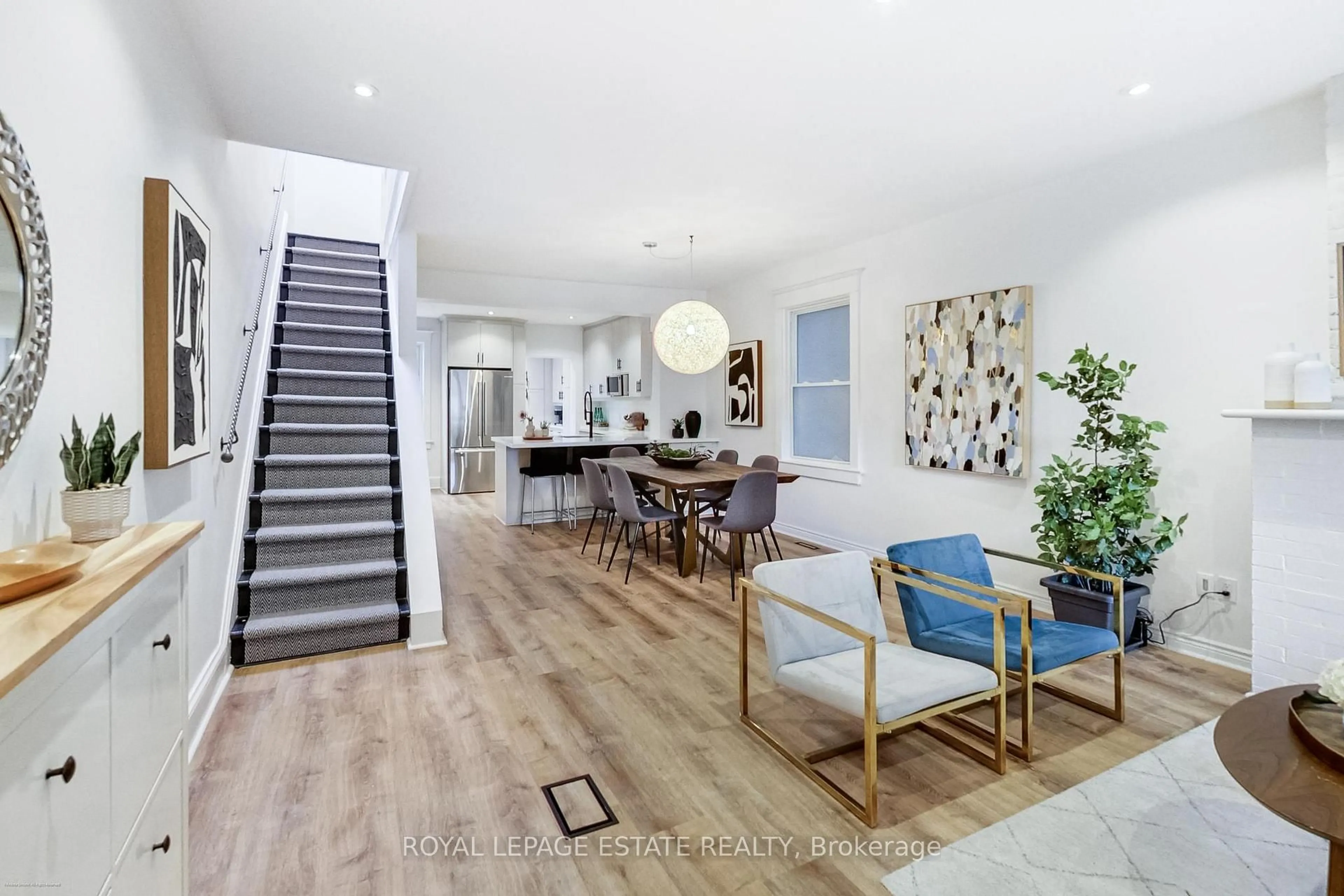 Open concept kitchen, wood/laminate floor for 165 Oakcrest Ave, Toronto Ontario M4C 1B8