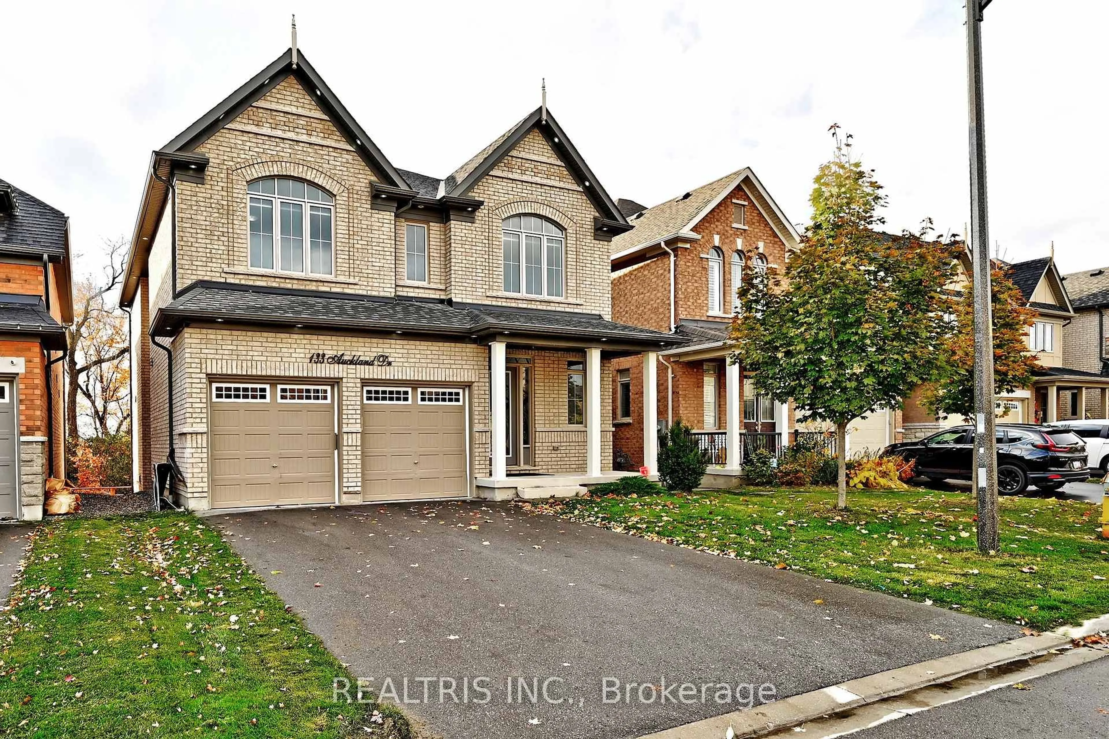 Home with brick exterior material, street for 133 Auckland Dr, Whitby Ontario L1P 0J4