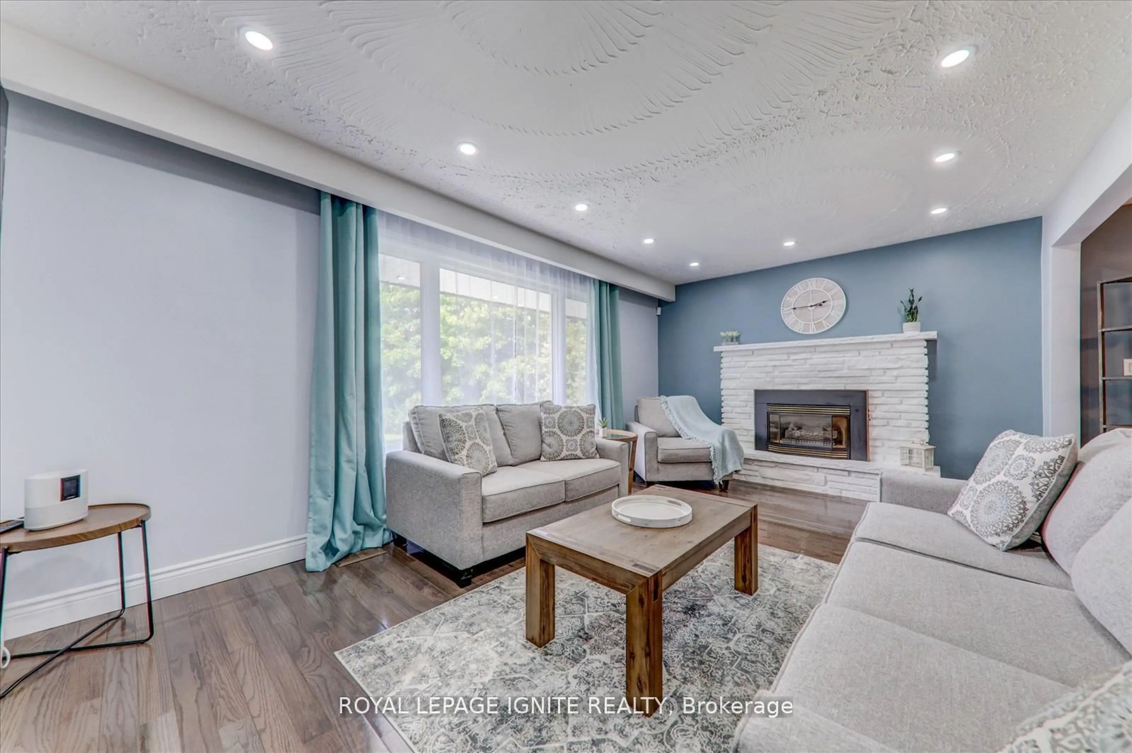 Living room with furniture, wood/laminate floor for 4409 Hill St, Clarington Ontario L0A 1J0