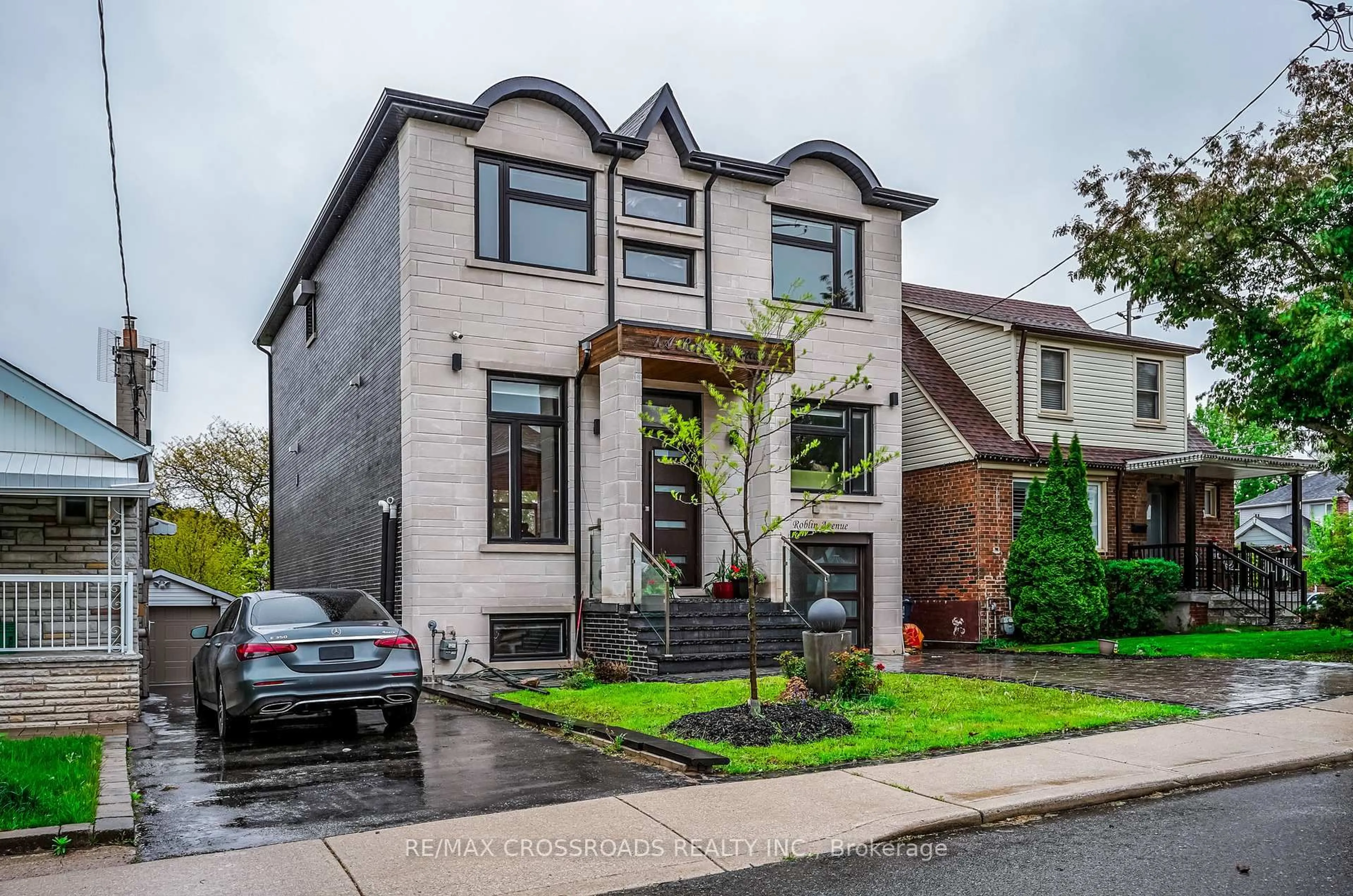 Home with brick exterior material, street for 1A Roblin Ave, Toronto Ontario M4C 3P7
