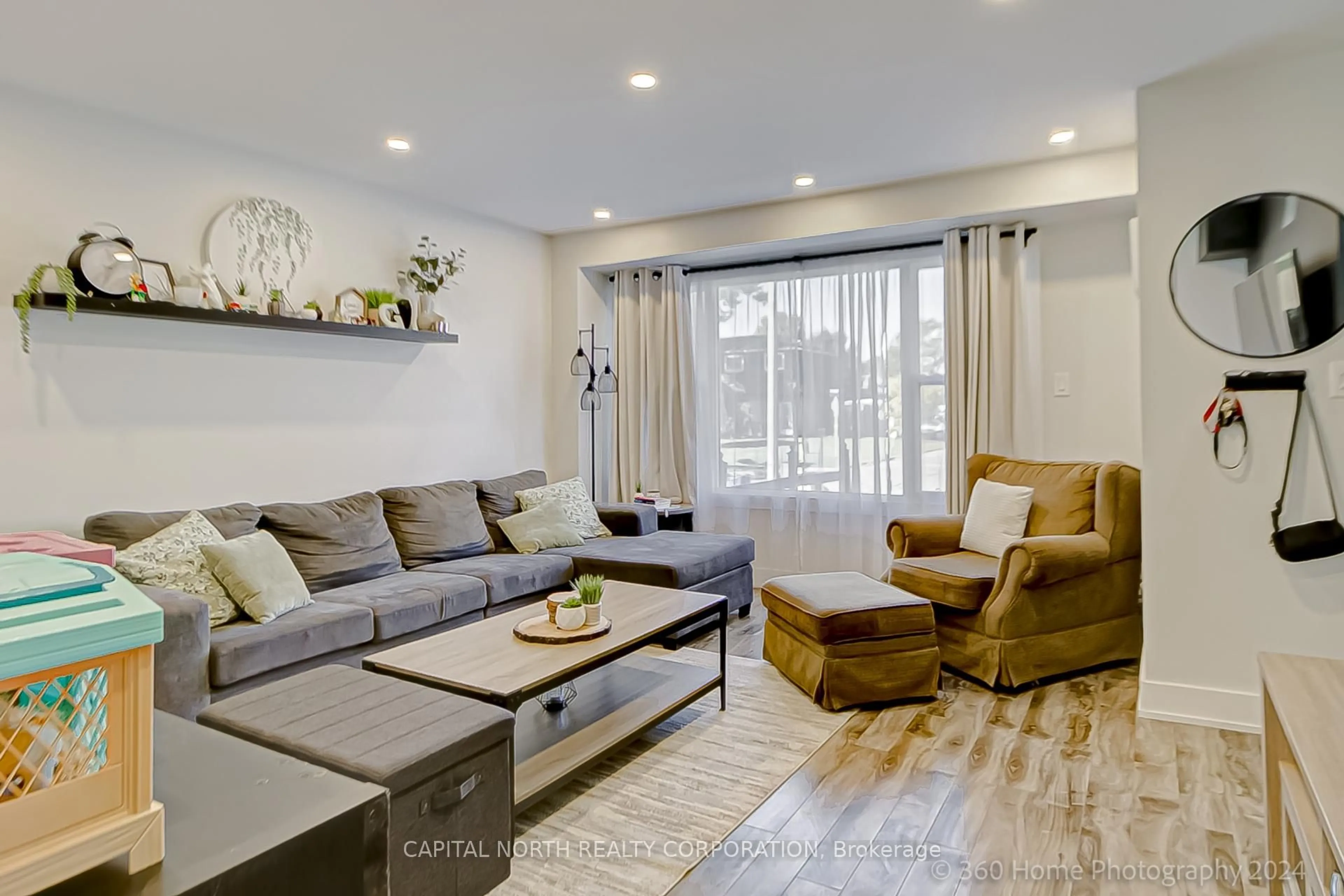 Living room with furniture, wood/laminate floor for 379 Dwight Ave, Oshawa Ontario L1J 1K8