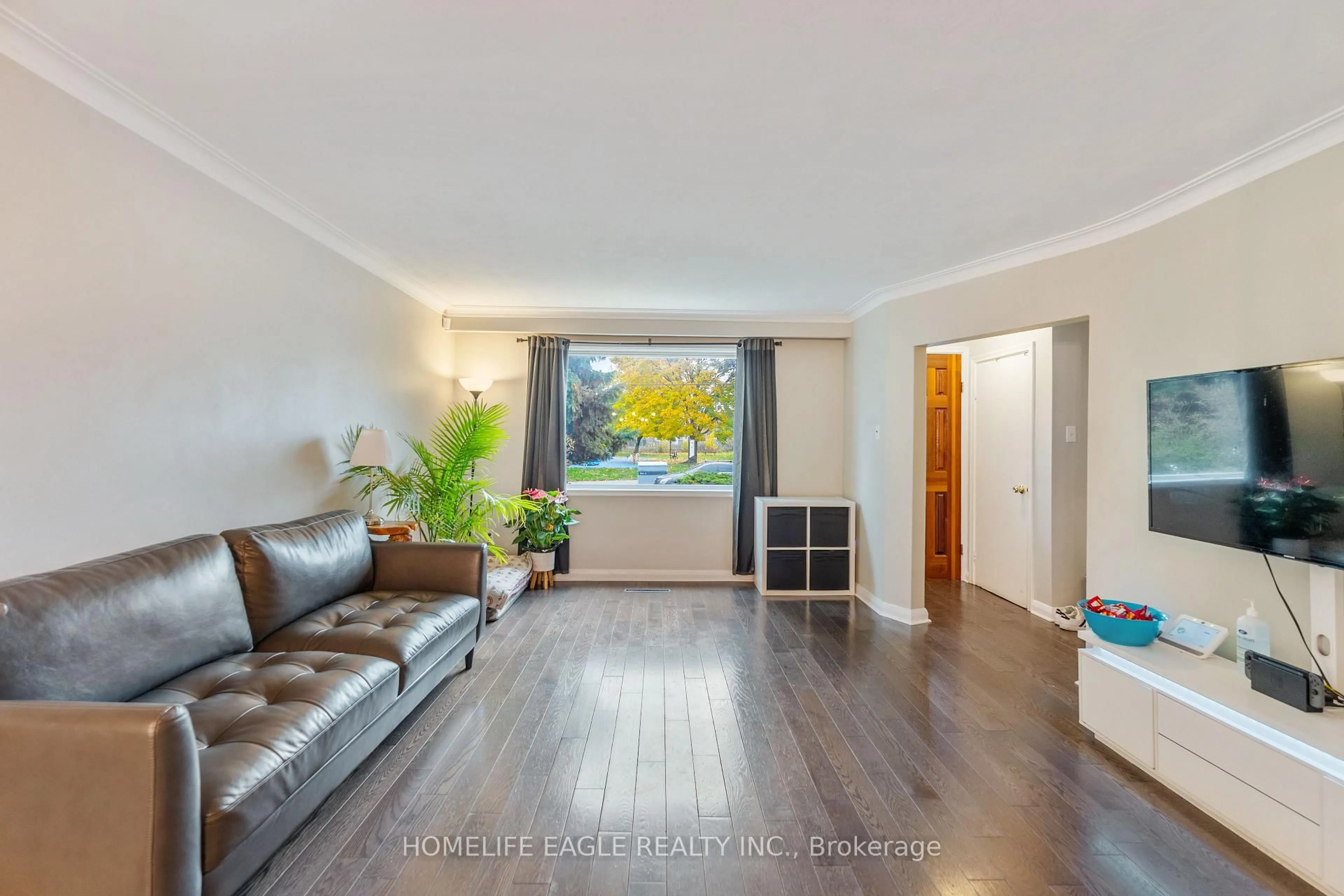 Living room with furniture, wood/laminate floor for 146 Raleigh Ave, Toronto Ontario M1K 1A4