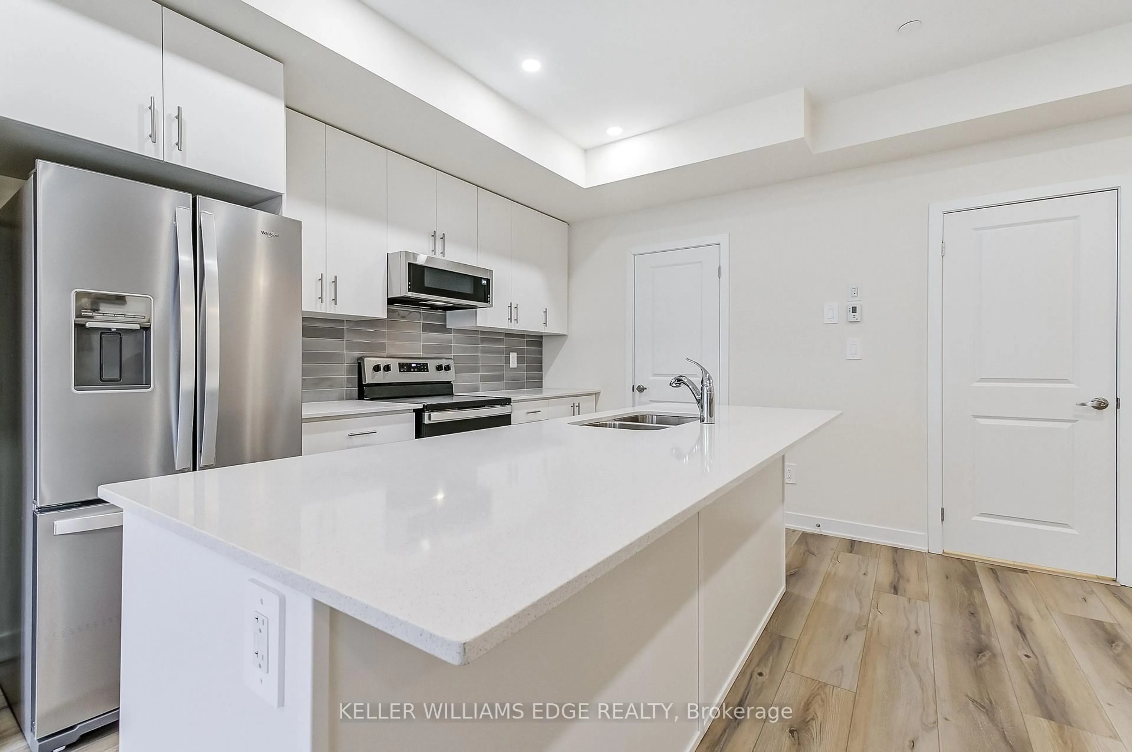 Open concept kitchen, unknown for 755 Omega Dr #202, Pickering Ontario L1V 0H1