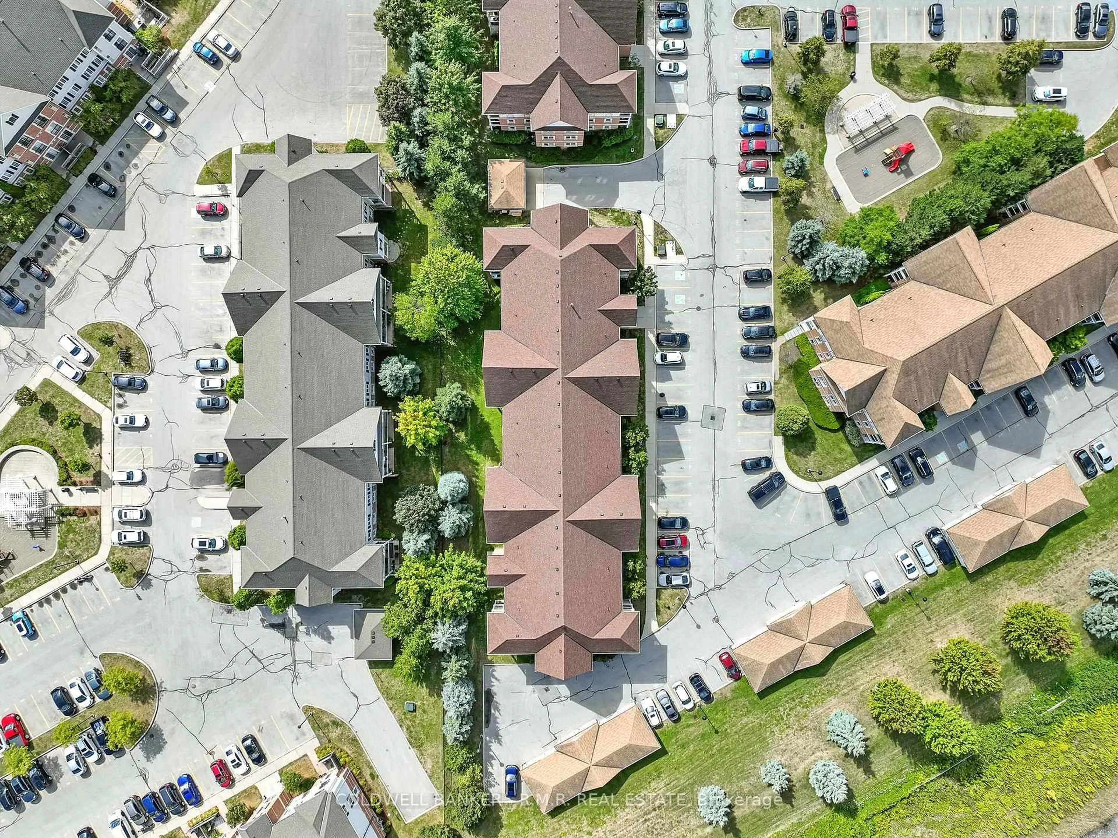 A pic from outside/outdoor area/front of a property/back of a property/a pic from drone, street for 124 Aspen Springs Dr #310, Clarington Ontario L1C 0G8