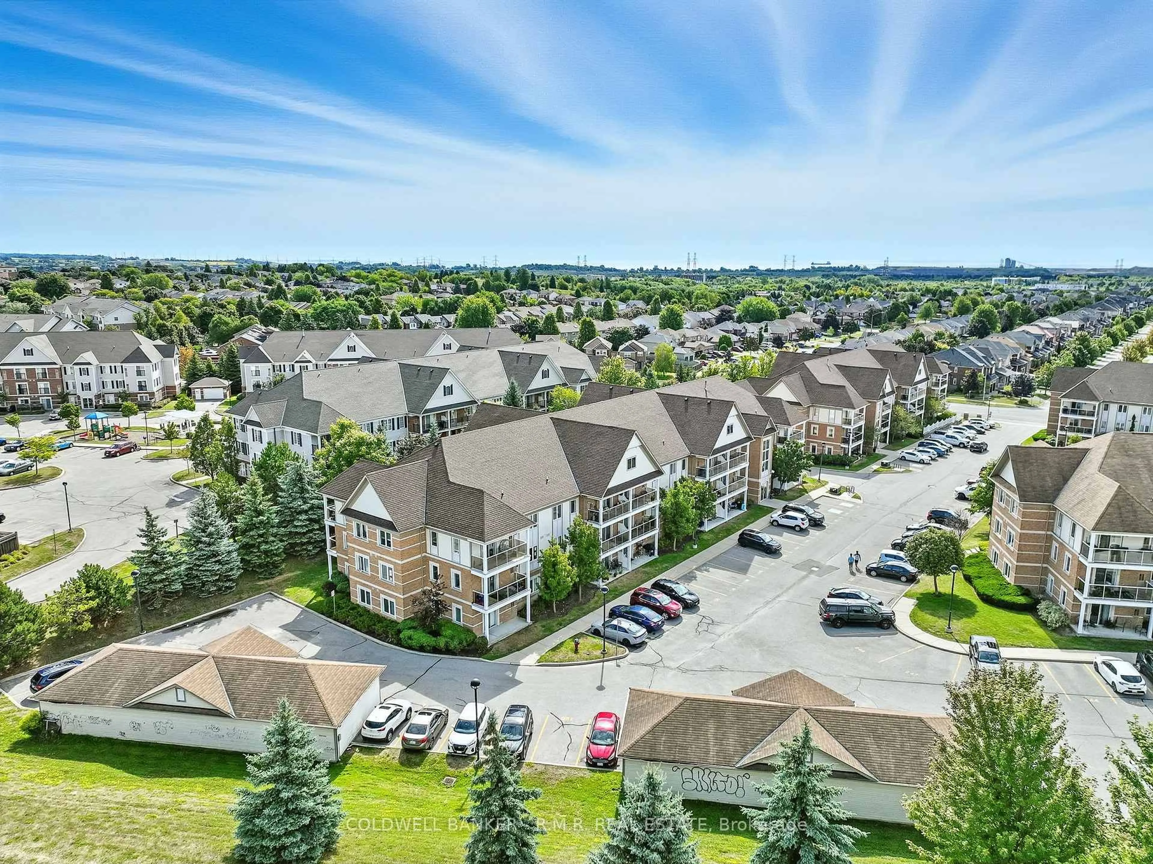 A pic from outside/outdoor area/front of a property/back of a property/a pic from drone, mountain view for 124 Aspen Springs Dr #310, Clarington Ontario L1C 0G8