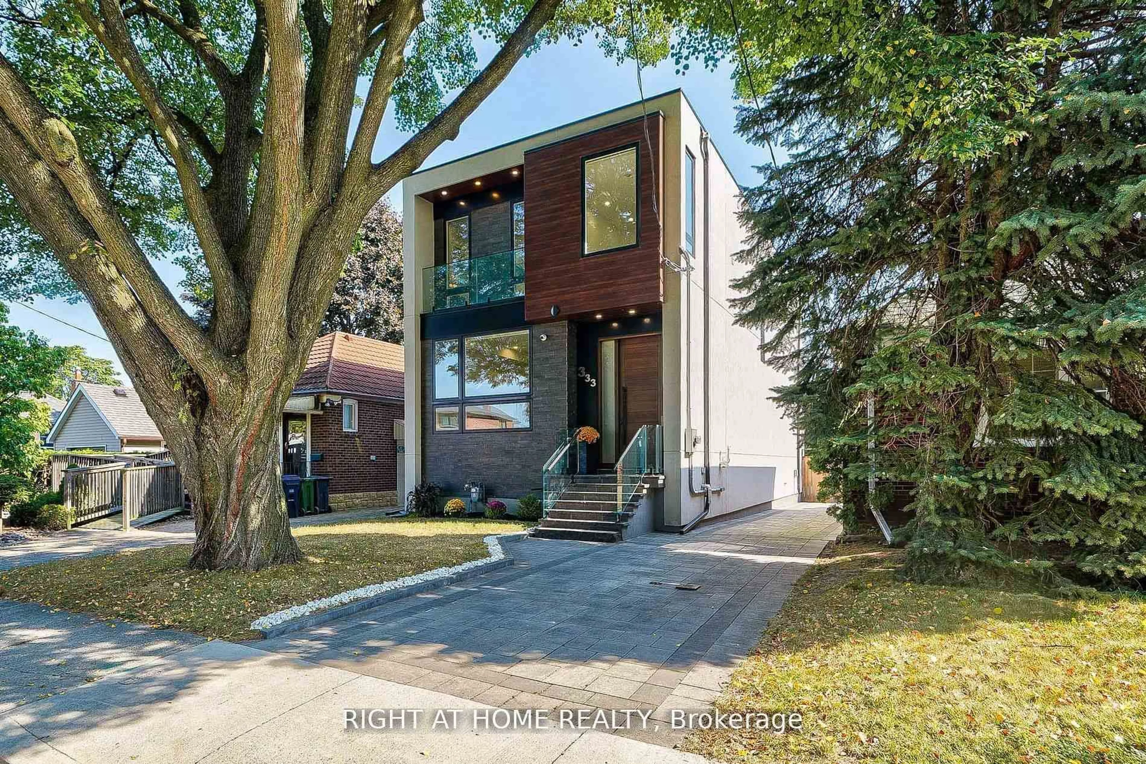 Home with brick exterior material, street for 333 Woodmount Ave, Toronto Ontario M4C 4A4