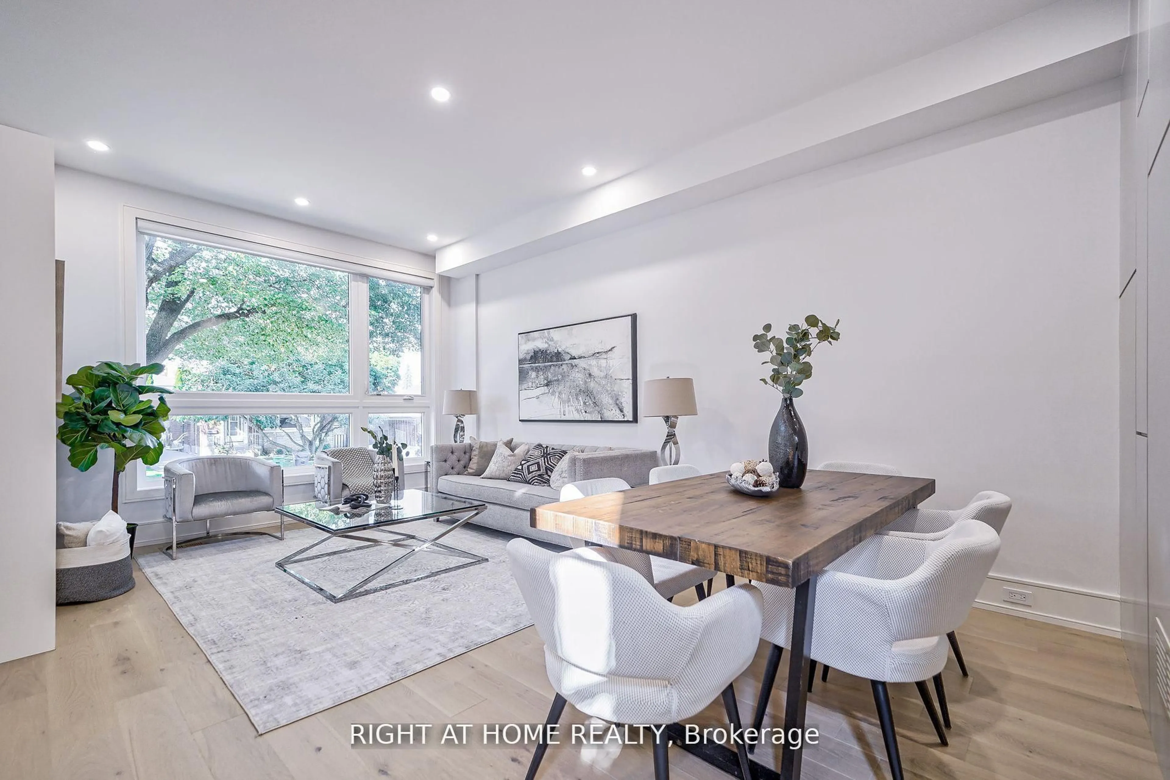 Living room with furniture, wood/laminate floor for 333 Woodmount Ave, Toronto Ontario M4C 4A4