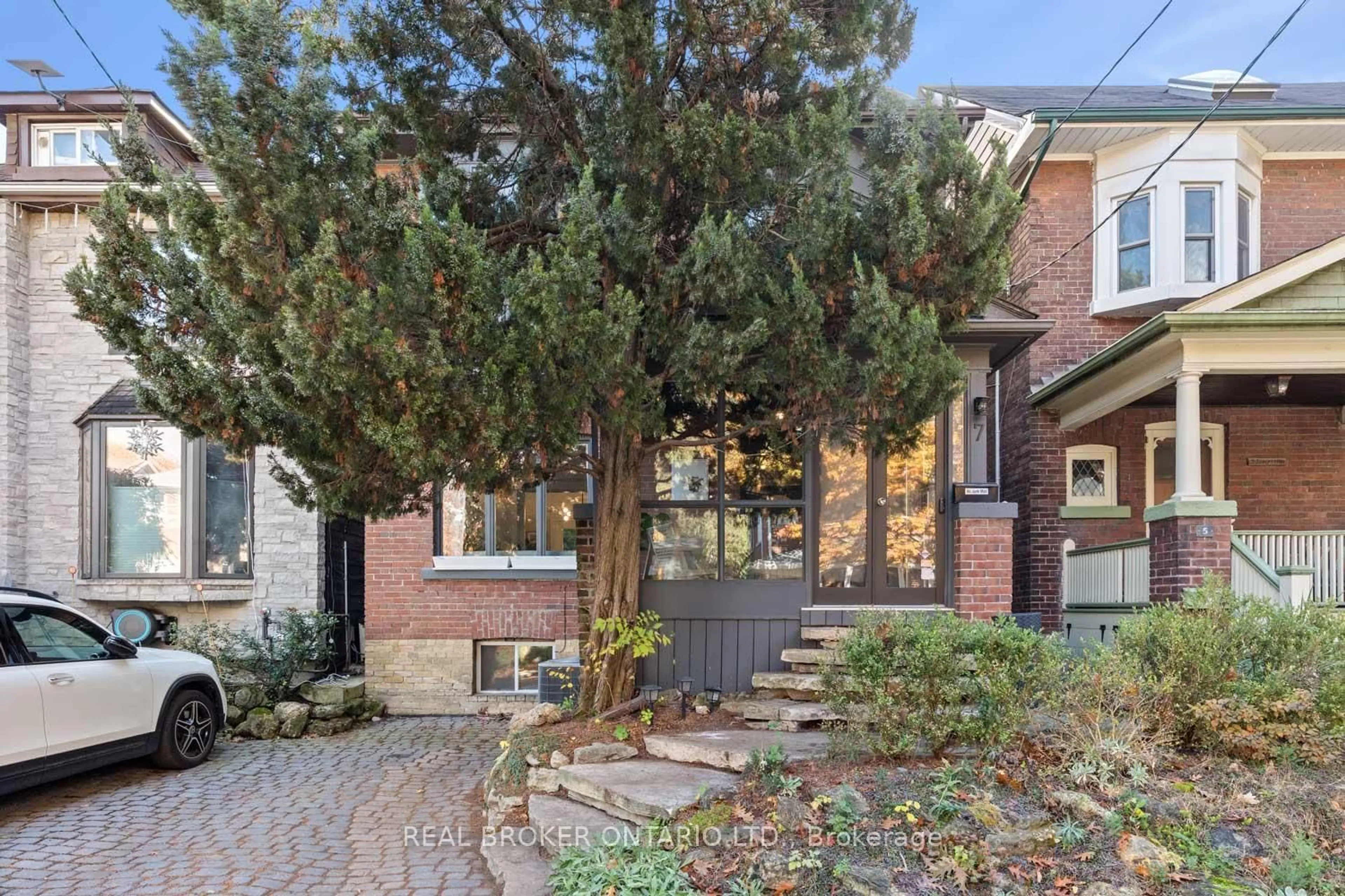 Home with brick exterior material, street for 7 Juniper Ave, Toronto Ontario M4L 1S1