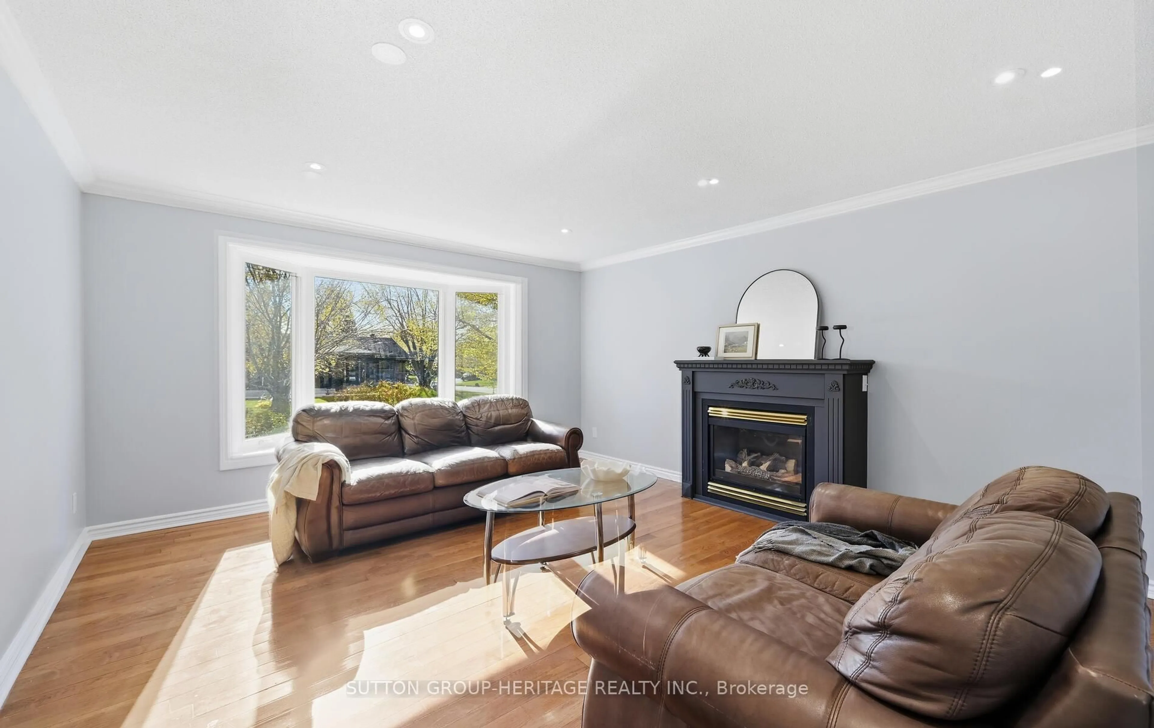 Living room with furniture, wood/laminate floor for 39 Anstead Cres, Ajax Ontario L1S 3X4