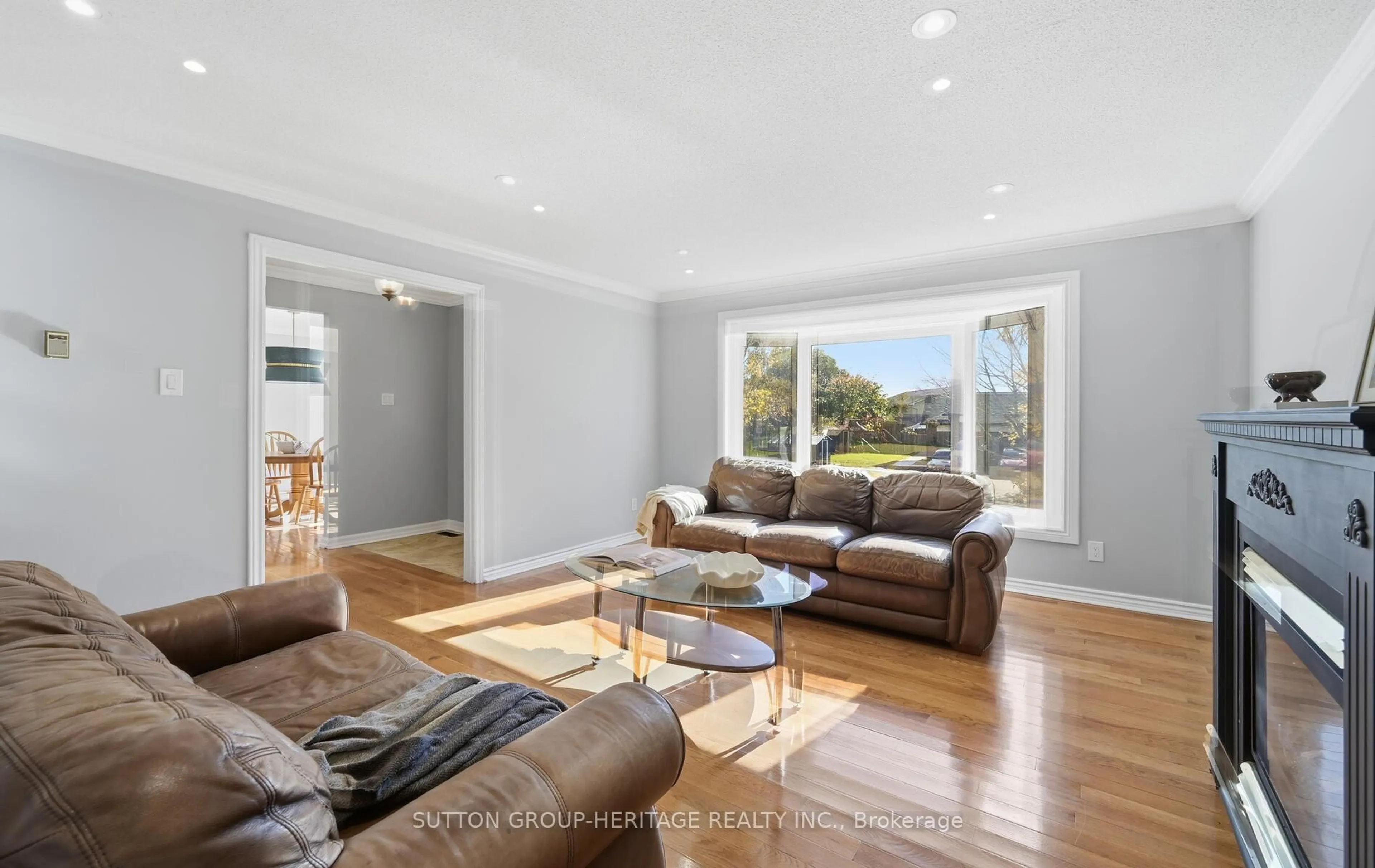 Living room with furniture, wood/laminate floor for 39 Anstead Cres, Ajax Ontario L1S 3X4