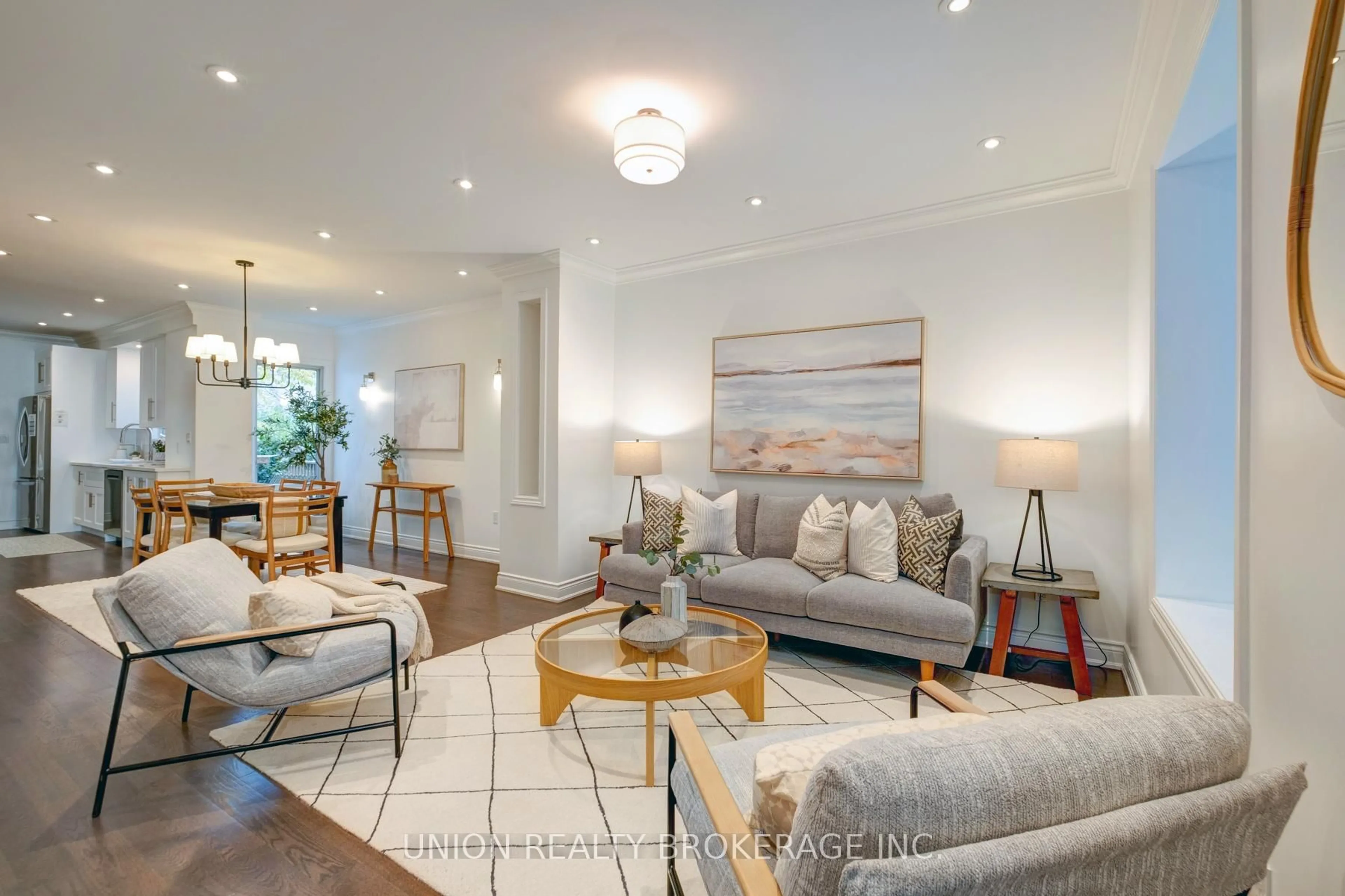 Living room with furniture, wood/laminate floor for 112 Withrow Ave, Toronto Ontario M4K 1C9