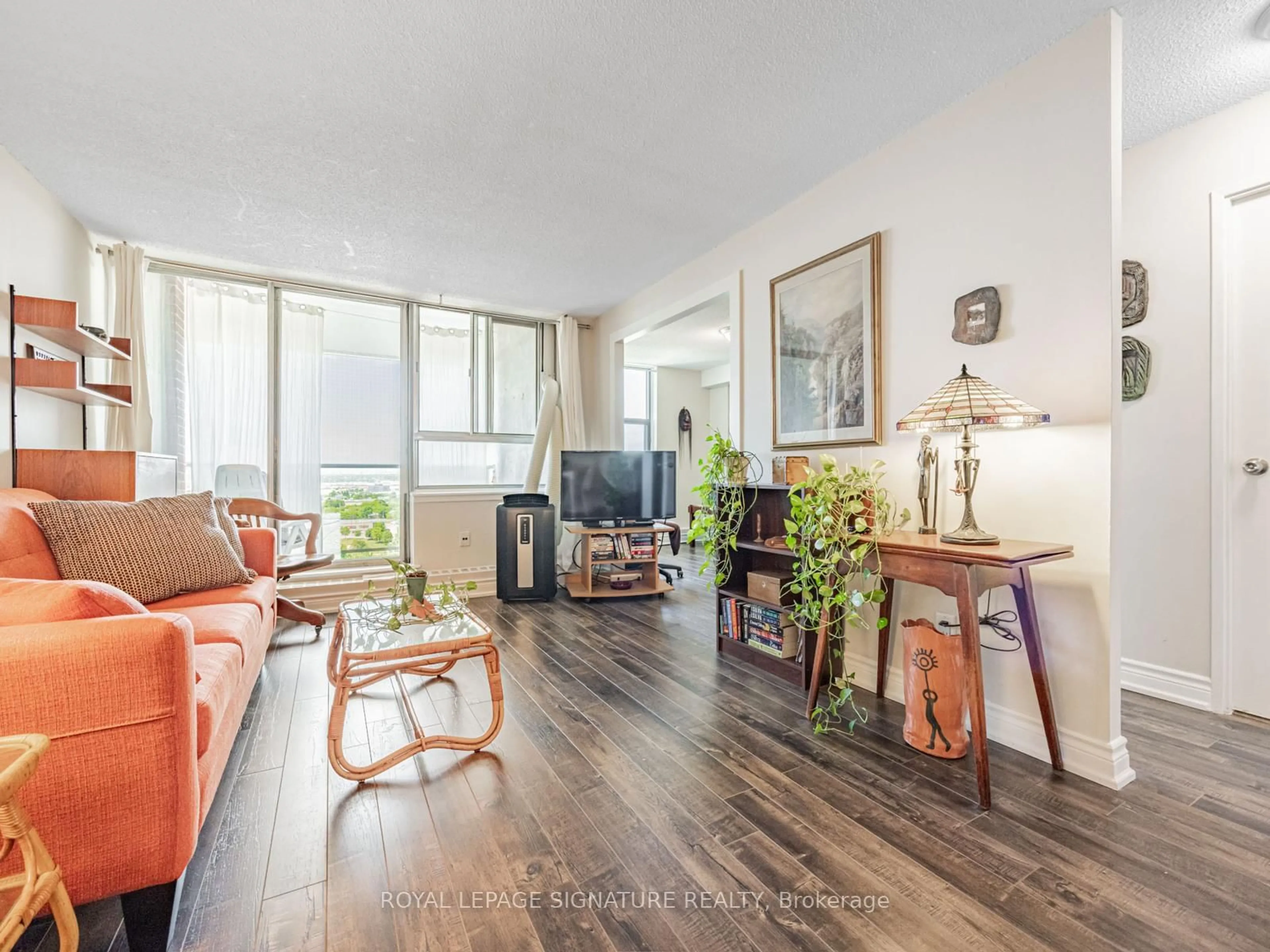 Living room with furniture, wood/laminate floor for 100 Wingarden Crt #2003, Toronto Ontario M1B 2P4