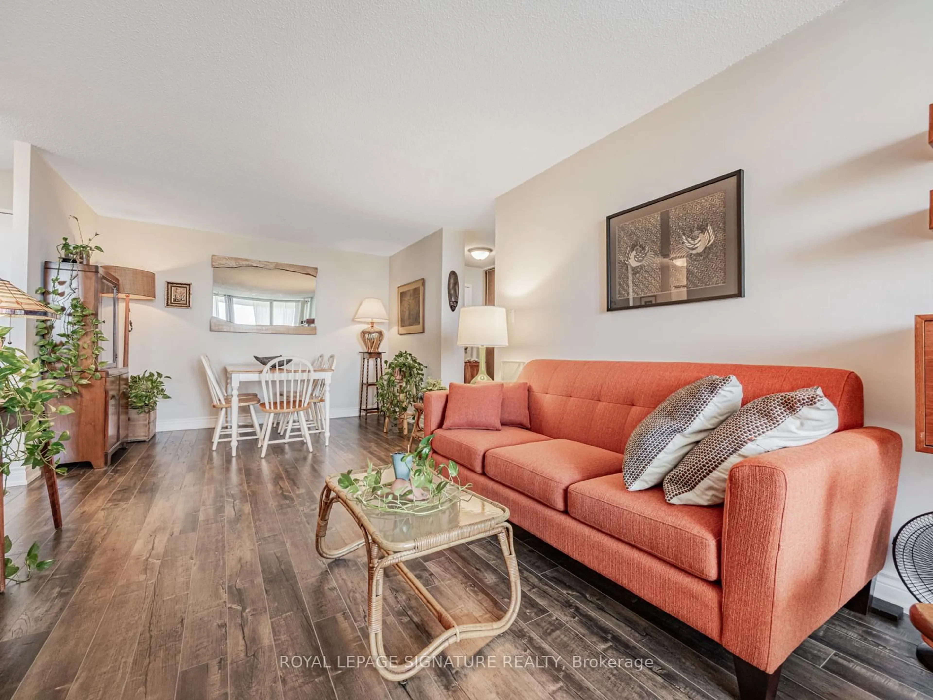 Living room with furniture, wood/laminate floor for 100 Wingarden Crt #2003, Toronto Ontario M1B 2P4