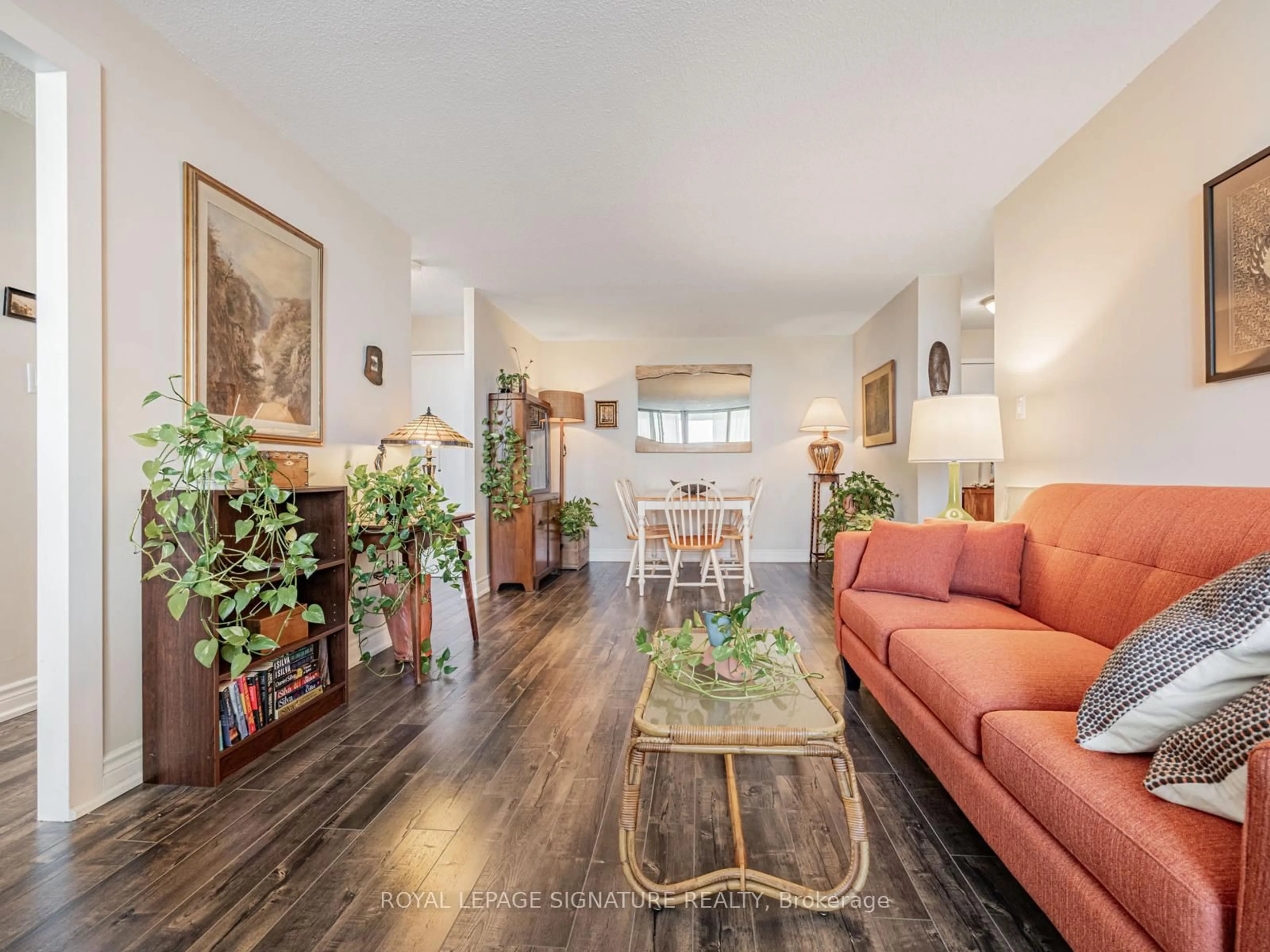 Living room with furniture, wood/laminate floor for 100 Wingarden Crt #2003, Toronto Ontario M1B 2P4