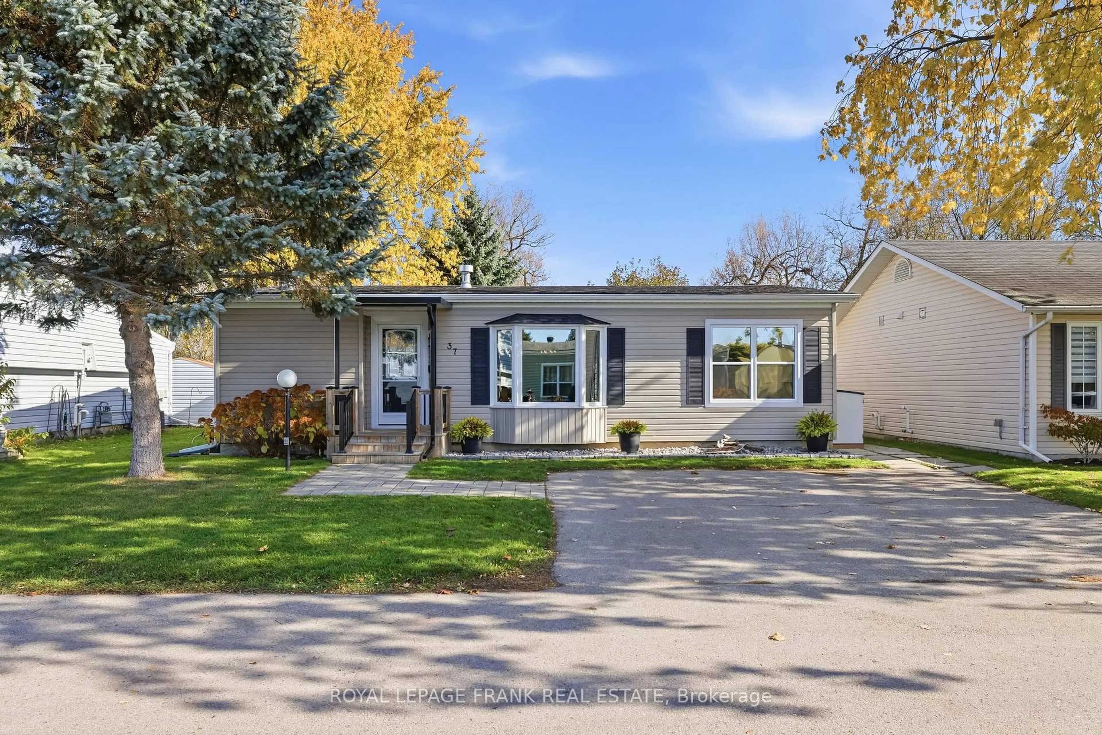 Home with vinyl exterior material, street for 37 Fairway Dr, Clarington Ontario L1B 1B4