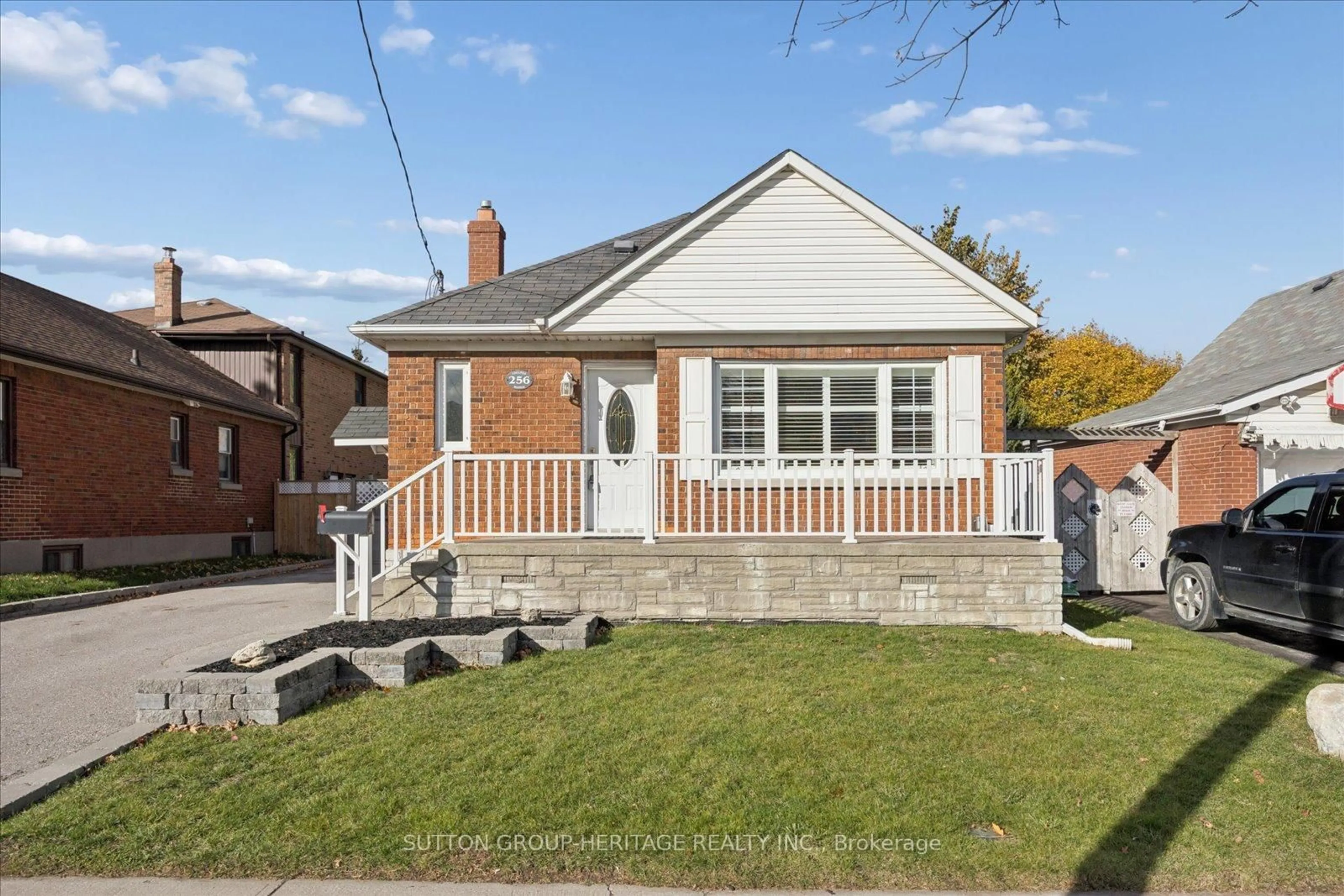 Home with brick exterior material, street for 256 College Ave, Oshawa Ontario L1J 1R7
