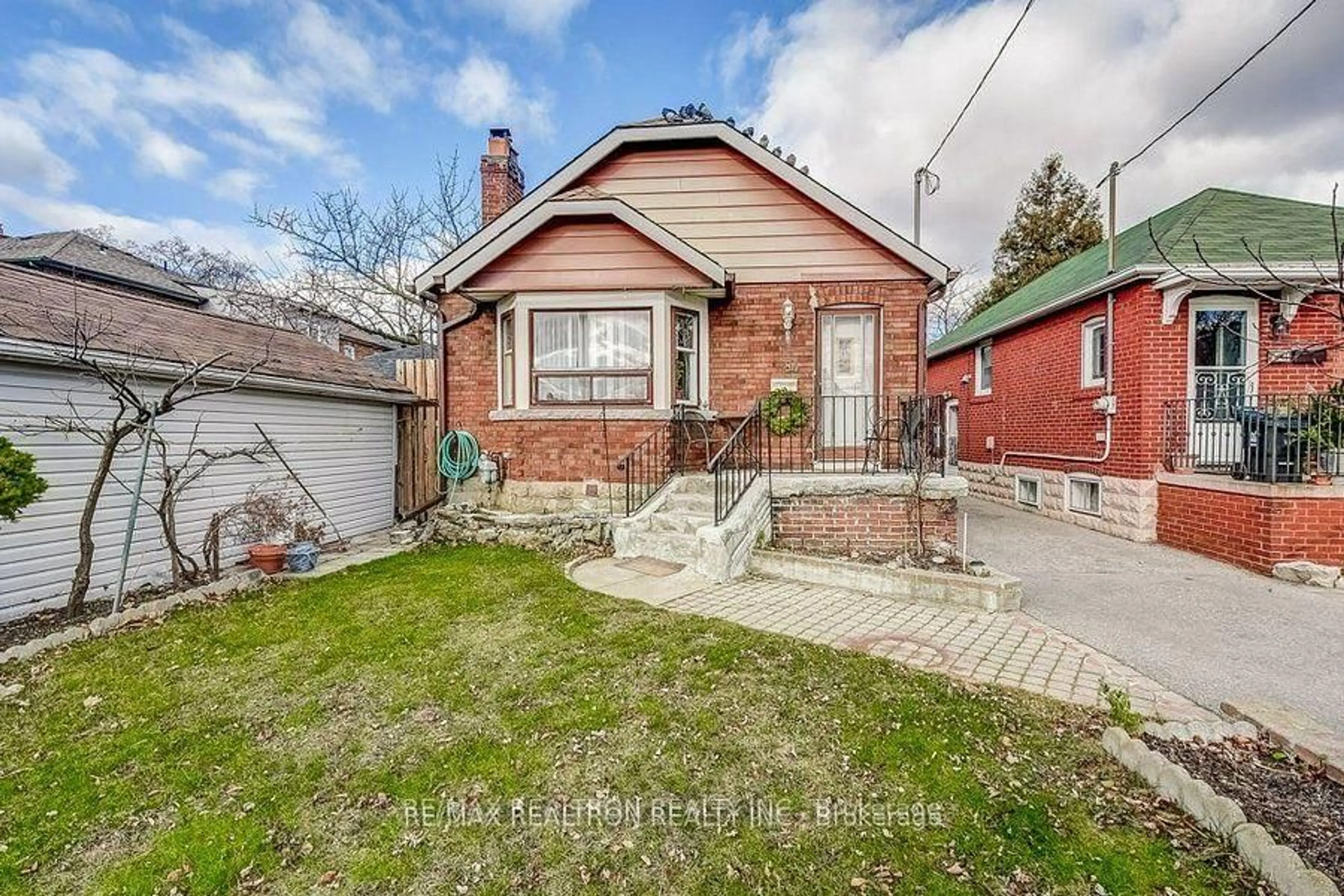 Home with brick exterior material, street for 84 Kings Park Blvd, Toronto Ontario M4J 2C3