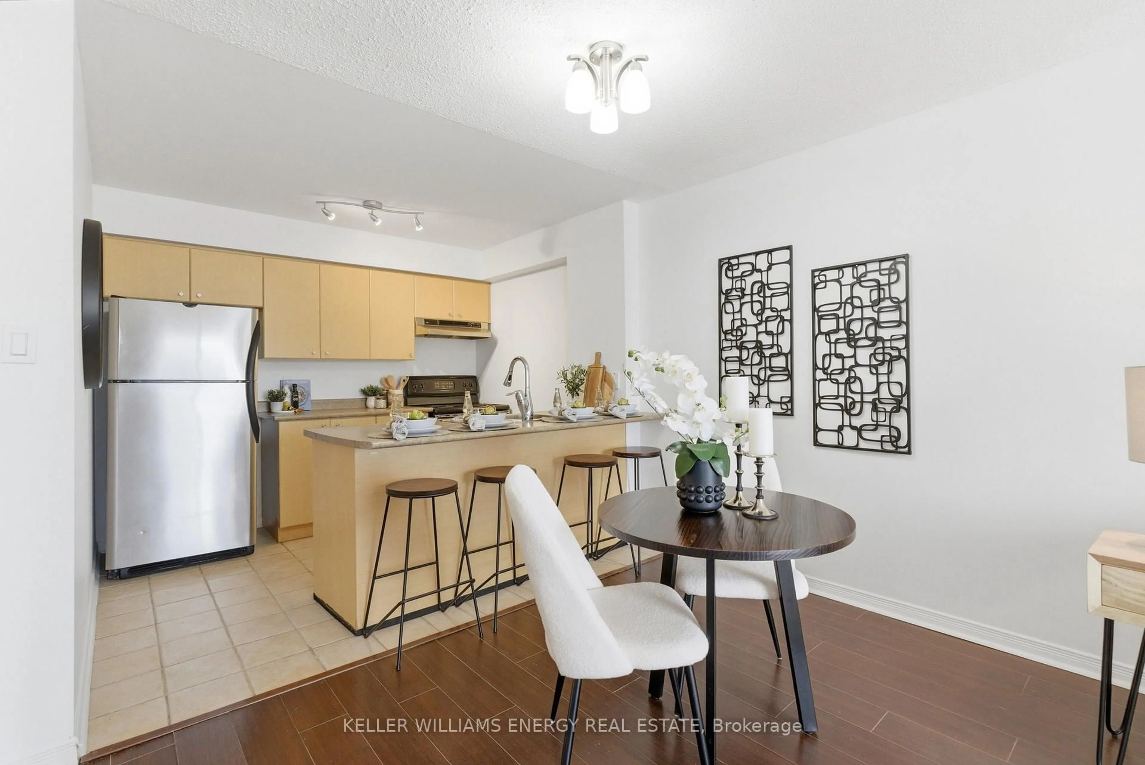 Open concept kitchen, wood/laminate floor for 90 Aspen Springs Dr #304, Clarington Ontario L1C 5N3