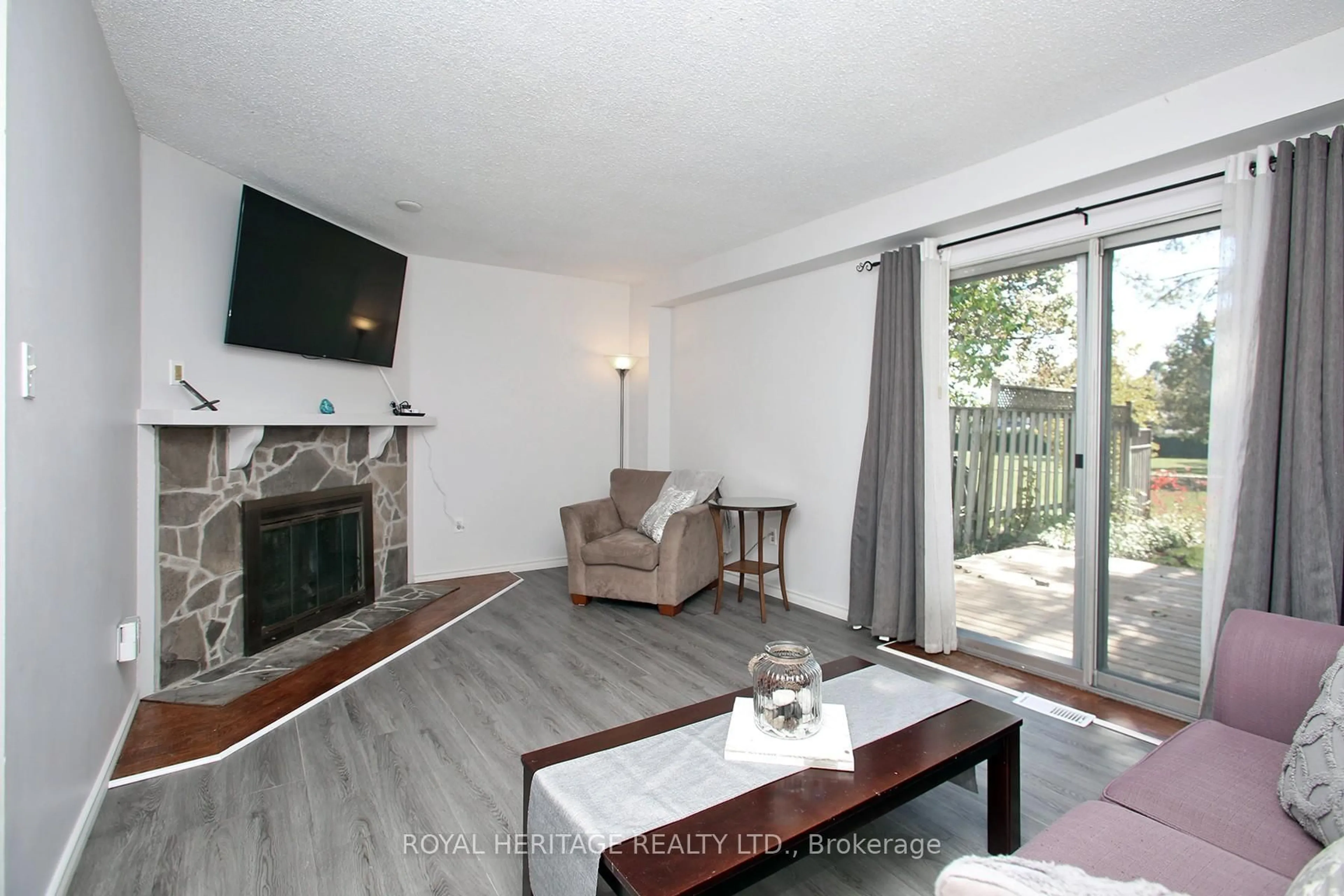 Living room with furniture, wood/laminate floor for 205 Northminster Crt, Oshawa Ontario L1G 7M6