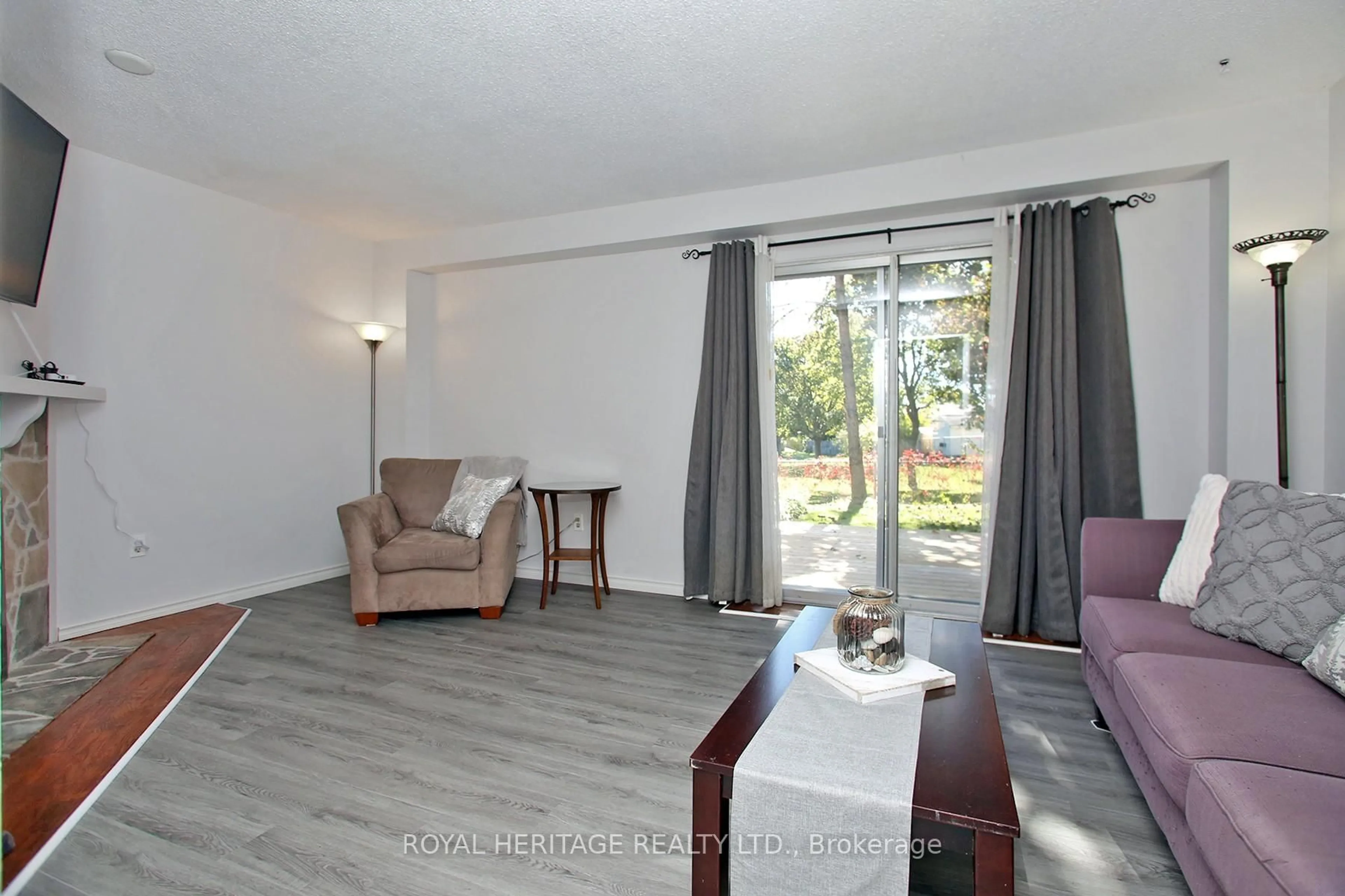 Living room with furniture, wood/laminate floor for 205 Northminster Crt, Oshawa Ontario L1G 7M6