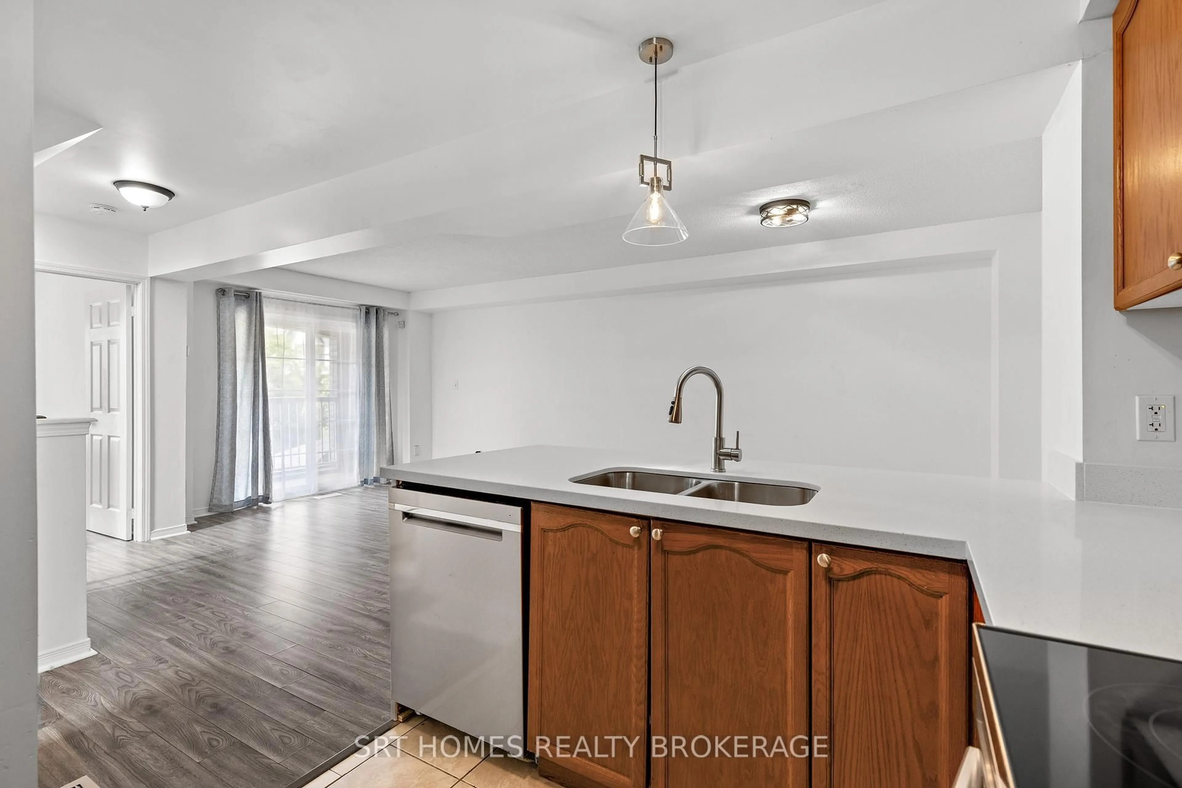 Open concept kitchen, wood/laminate floor for 21 Webbford St, Ajax Ontario L1S 0A8