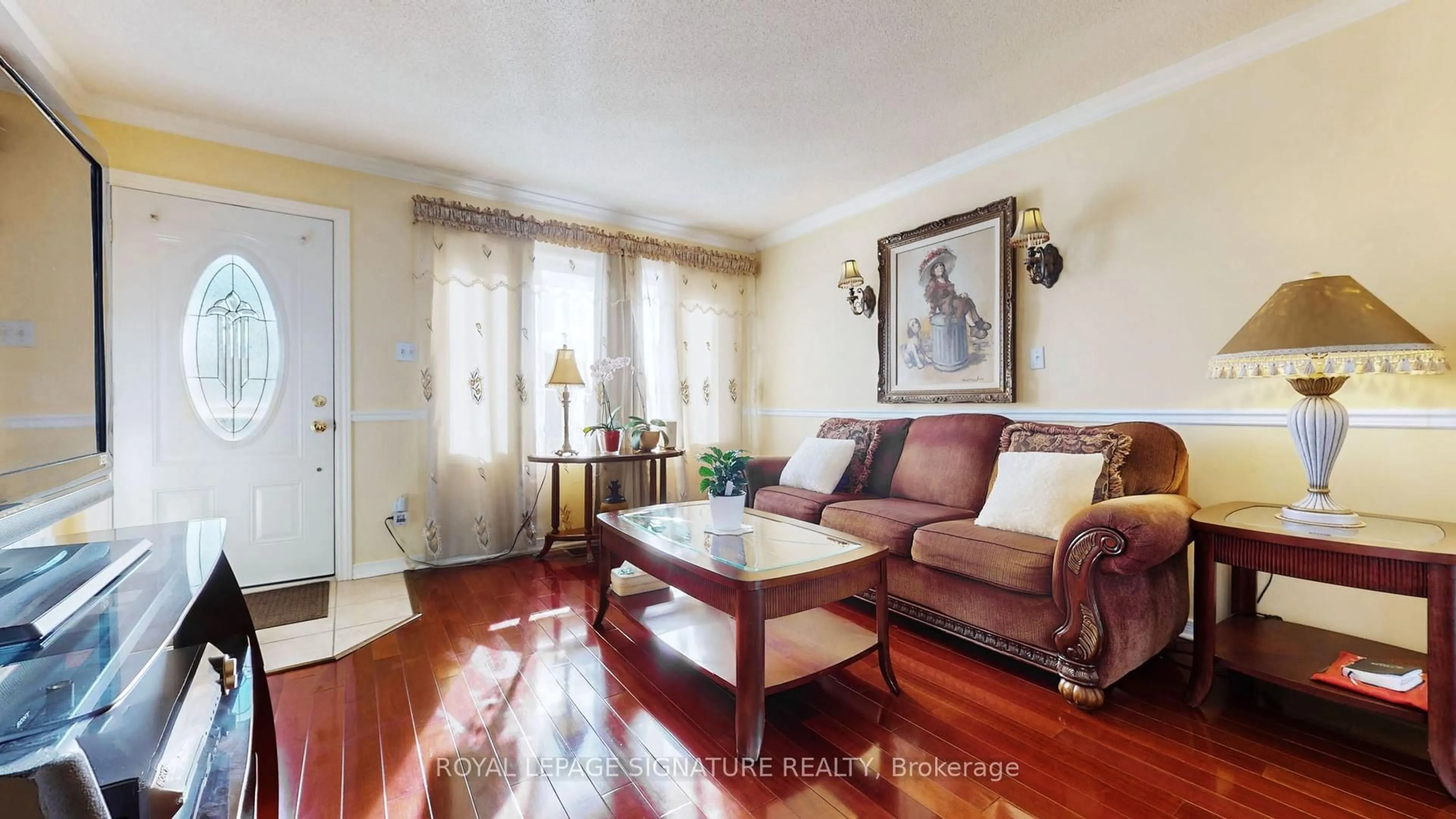 Living room with furniture, wood/laminate floor for 740 Kennedy Rd, Toronto Ontario M1K 2C5