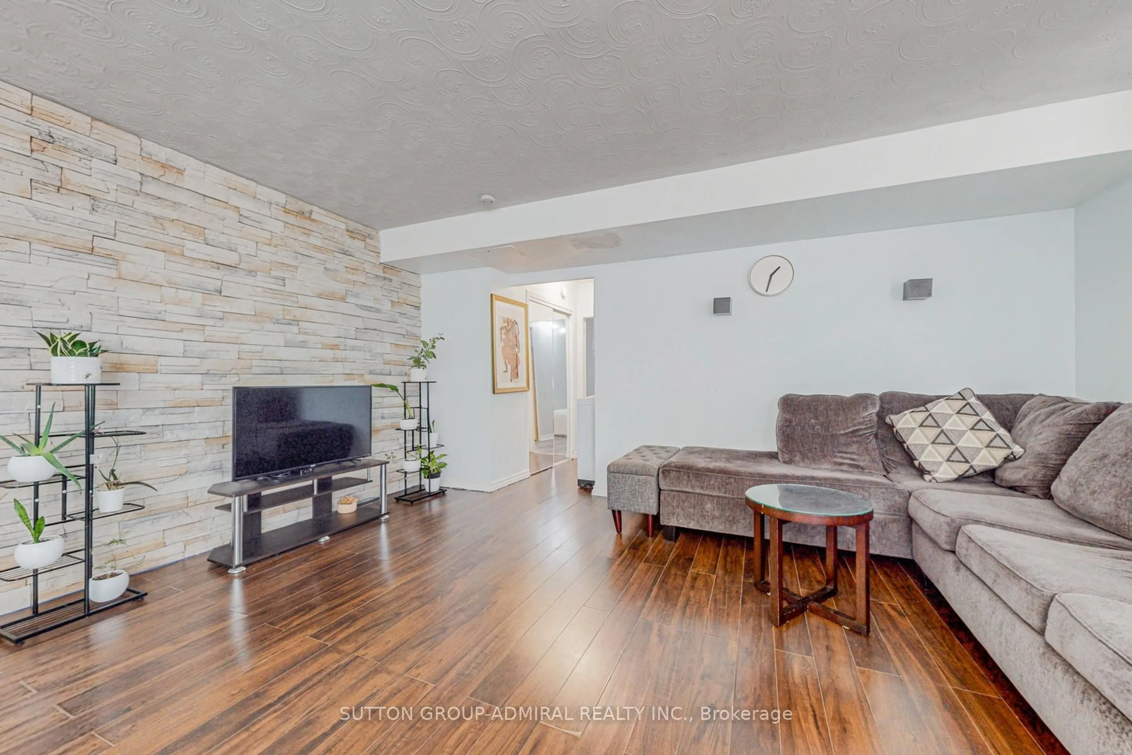 Living room with furniture, wood/laminate floor for 2245 Eglinton Ave #209, Toronto Ontario M1K 2N3