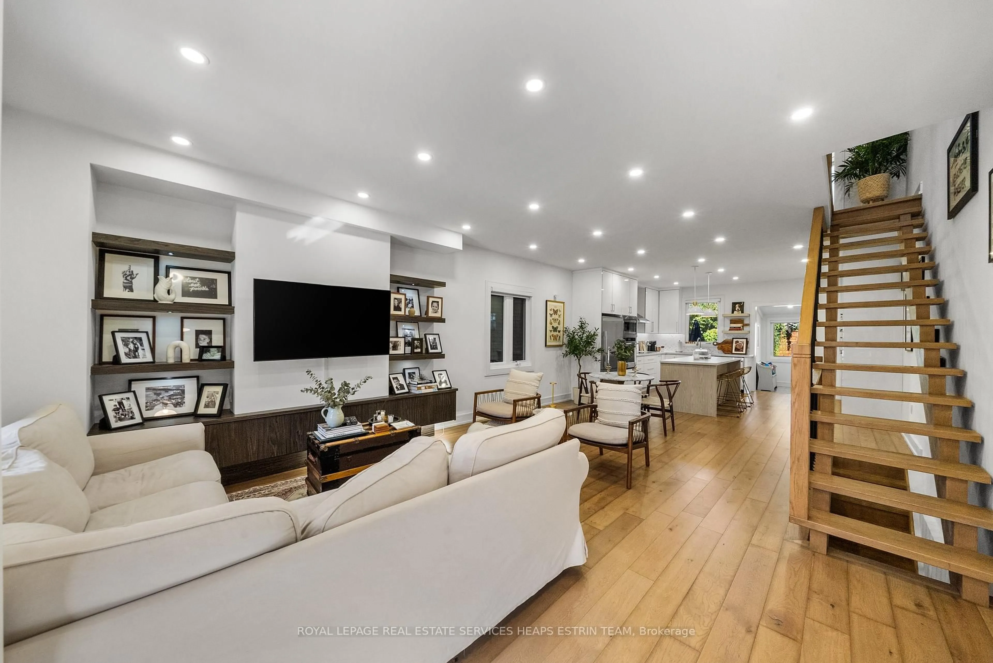 Living room with furniture, wood/laminate floor for 72 Harcourt Ave, Toronto Ontario M4J 1J2