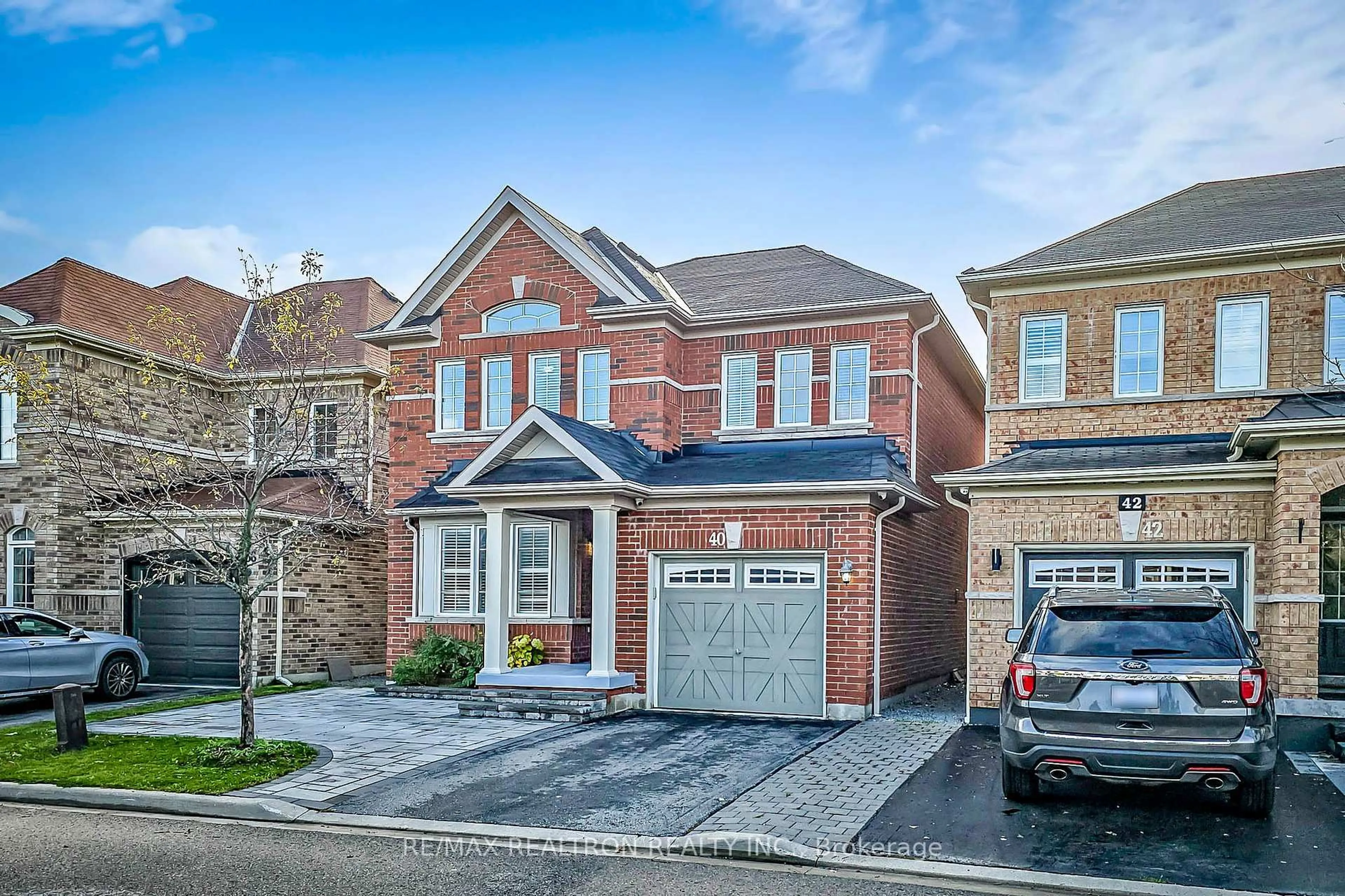 Home with brick exterior material, street for 40 Oswell Dr, Ajax Ontario L1Z 0L4