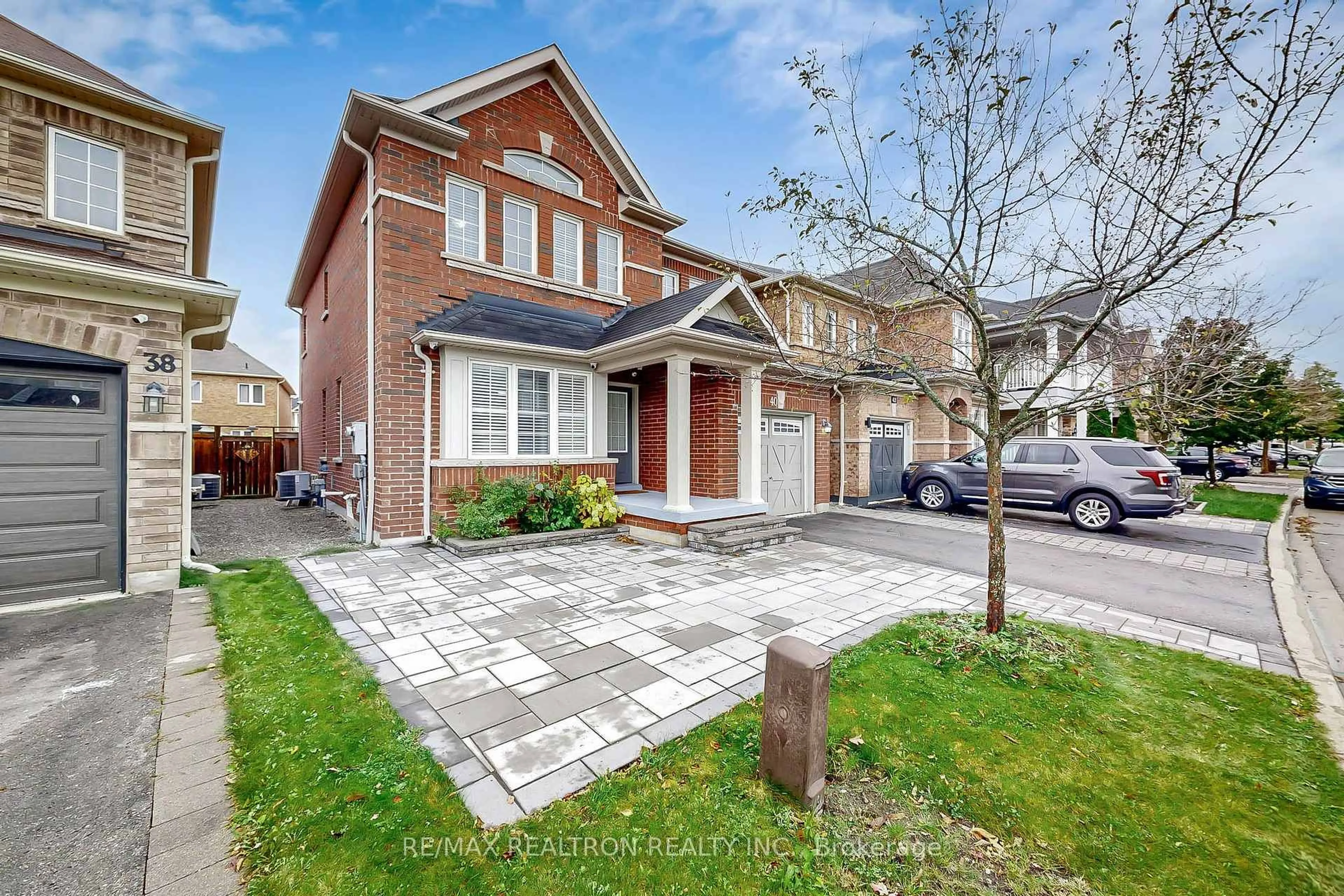 Home with brick exterior material, street for 40 Oswell Dr, Ajax Ontario L1Z 0L4