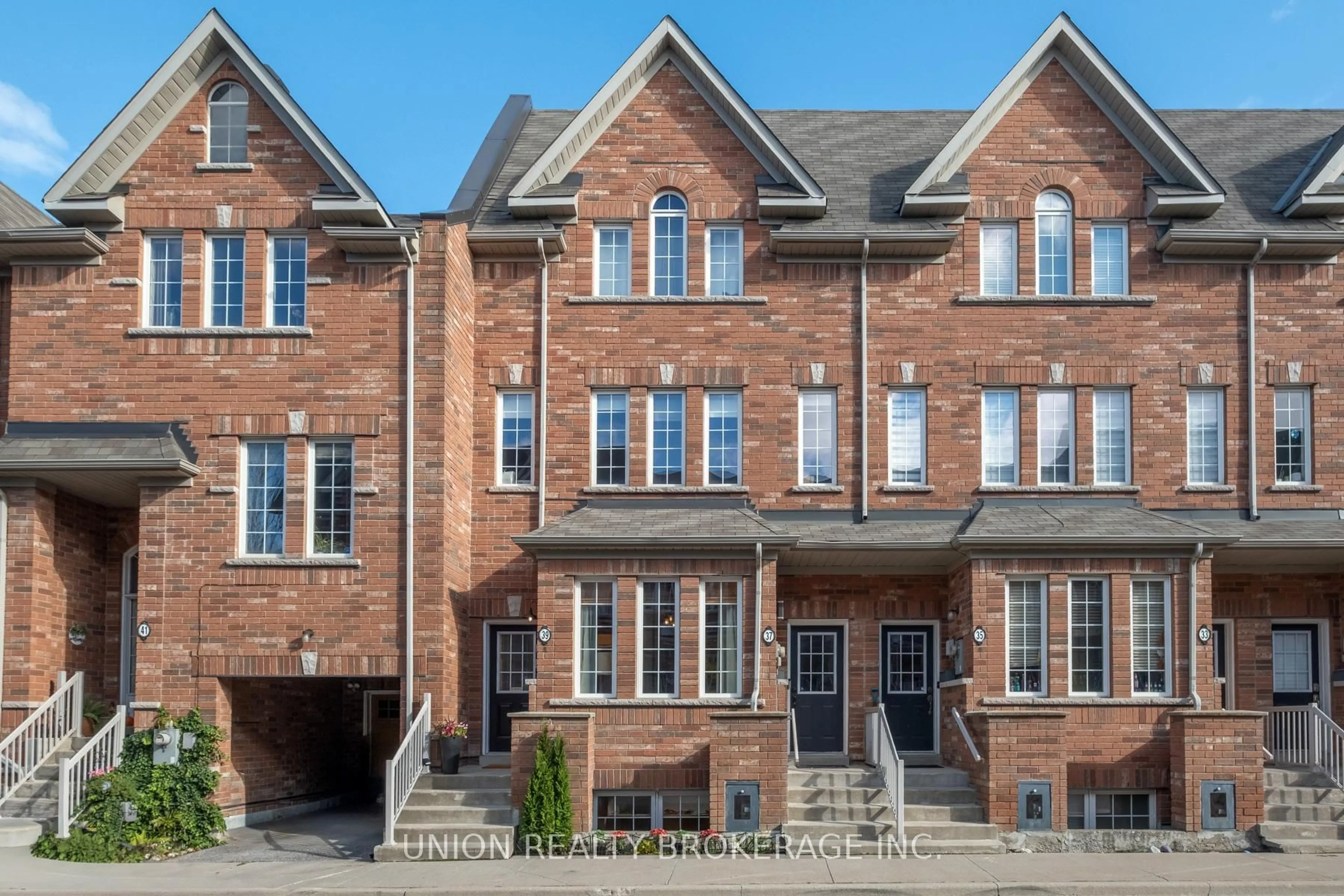 Home with brick exterior material, street for 39 Philpott Gdns, Toronto Ontario M4E 0A8