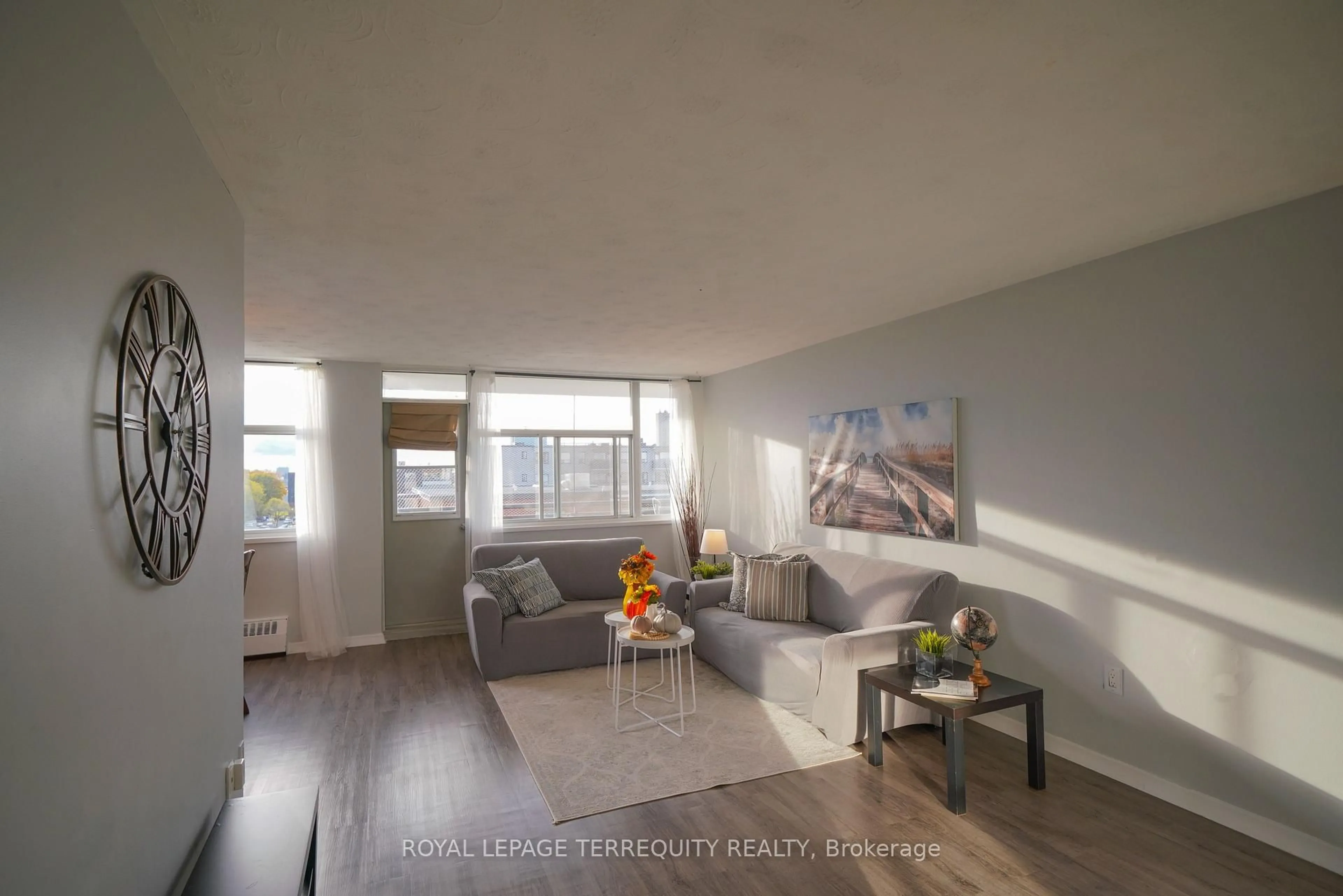 Living room with furniture, wood/laminate floor for 2245 Eglinton Ave #807, Toronto Ontario M1K 2N3