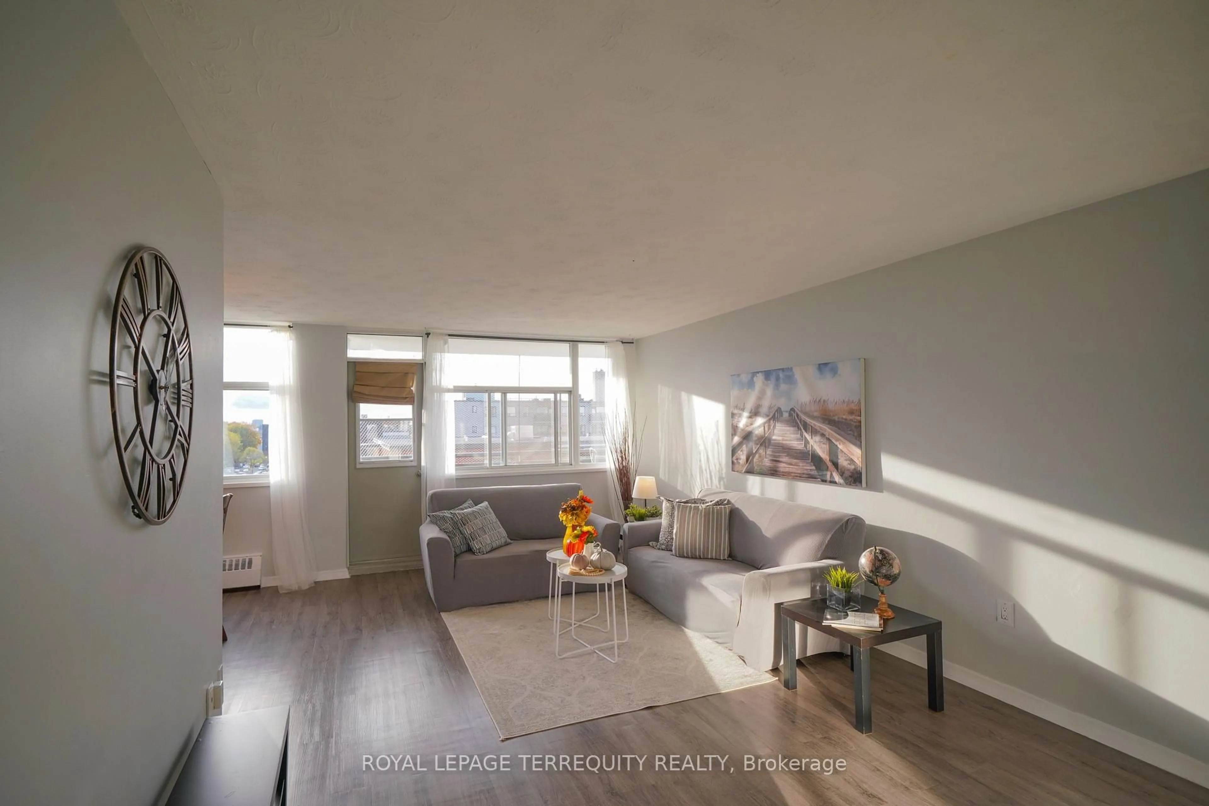 Living room with furniture, wood/laminate floor for 2245 Eglinton Ave #807, Toronto Ontario M1K 2N3