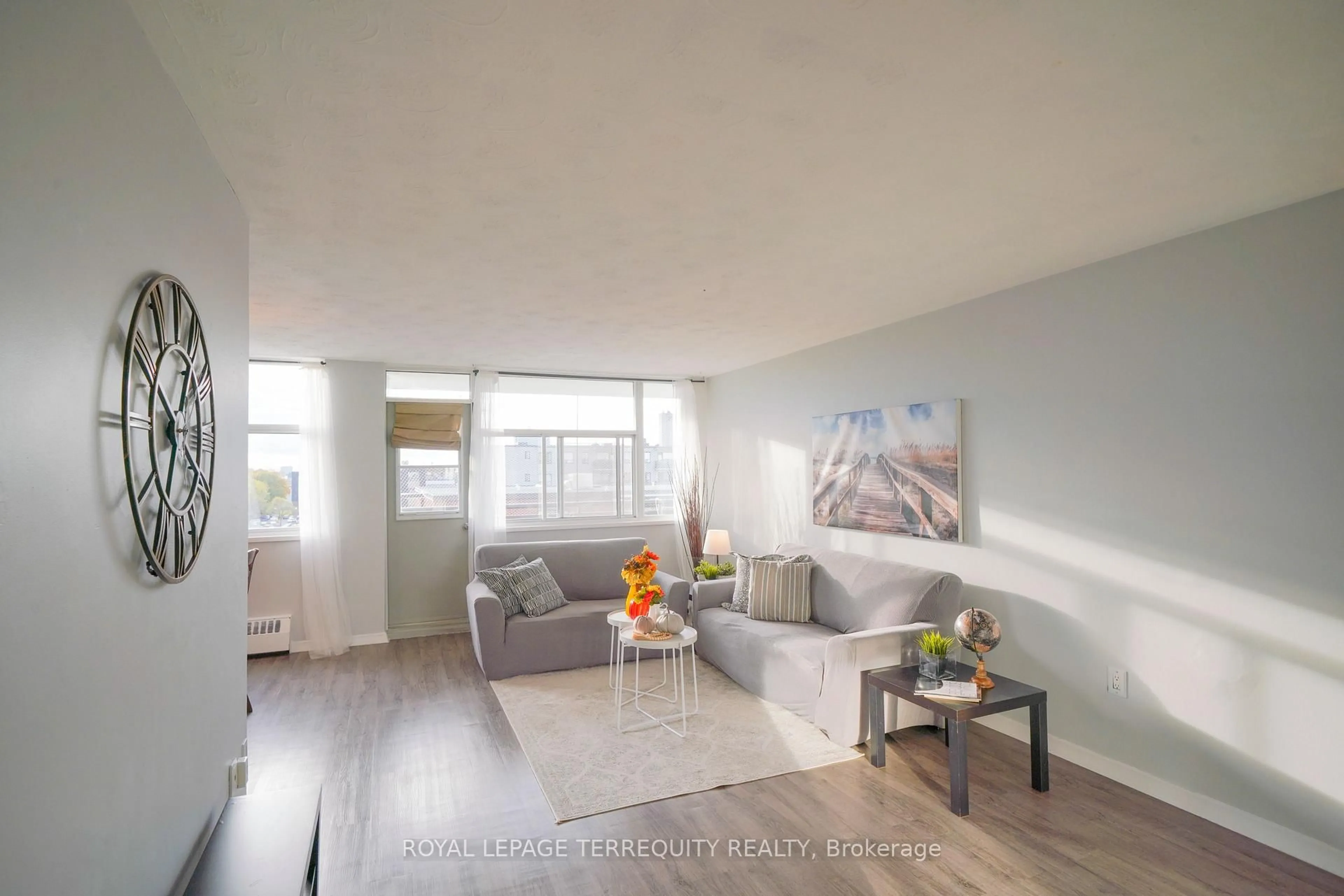 Living room with furniture, wood/laminate floor for 2245 Eglinton Ave #807, Toronto Ontario M1K 2N3